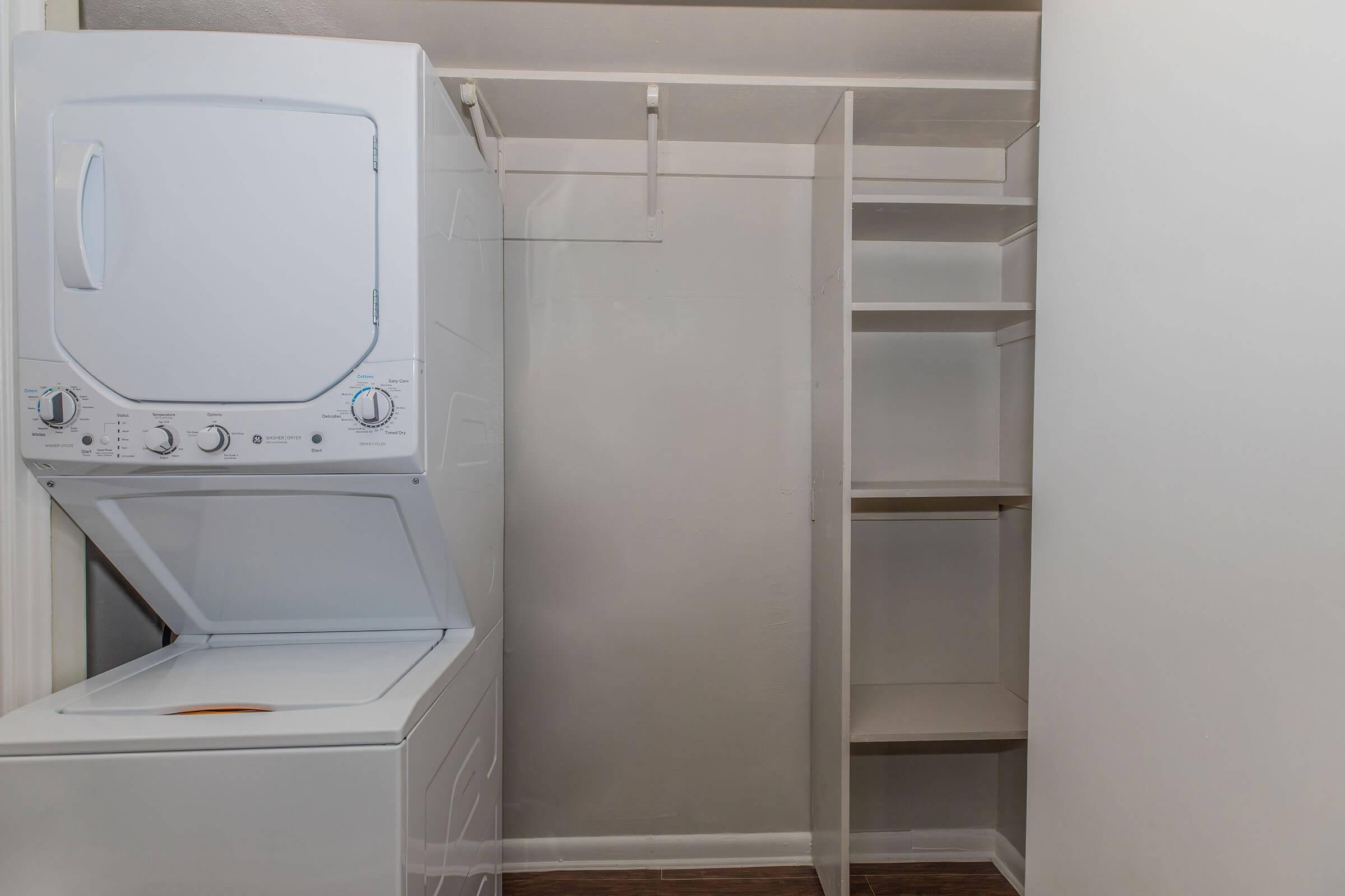 a microwave oven sitting on top of a refrigerator