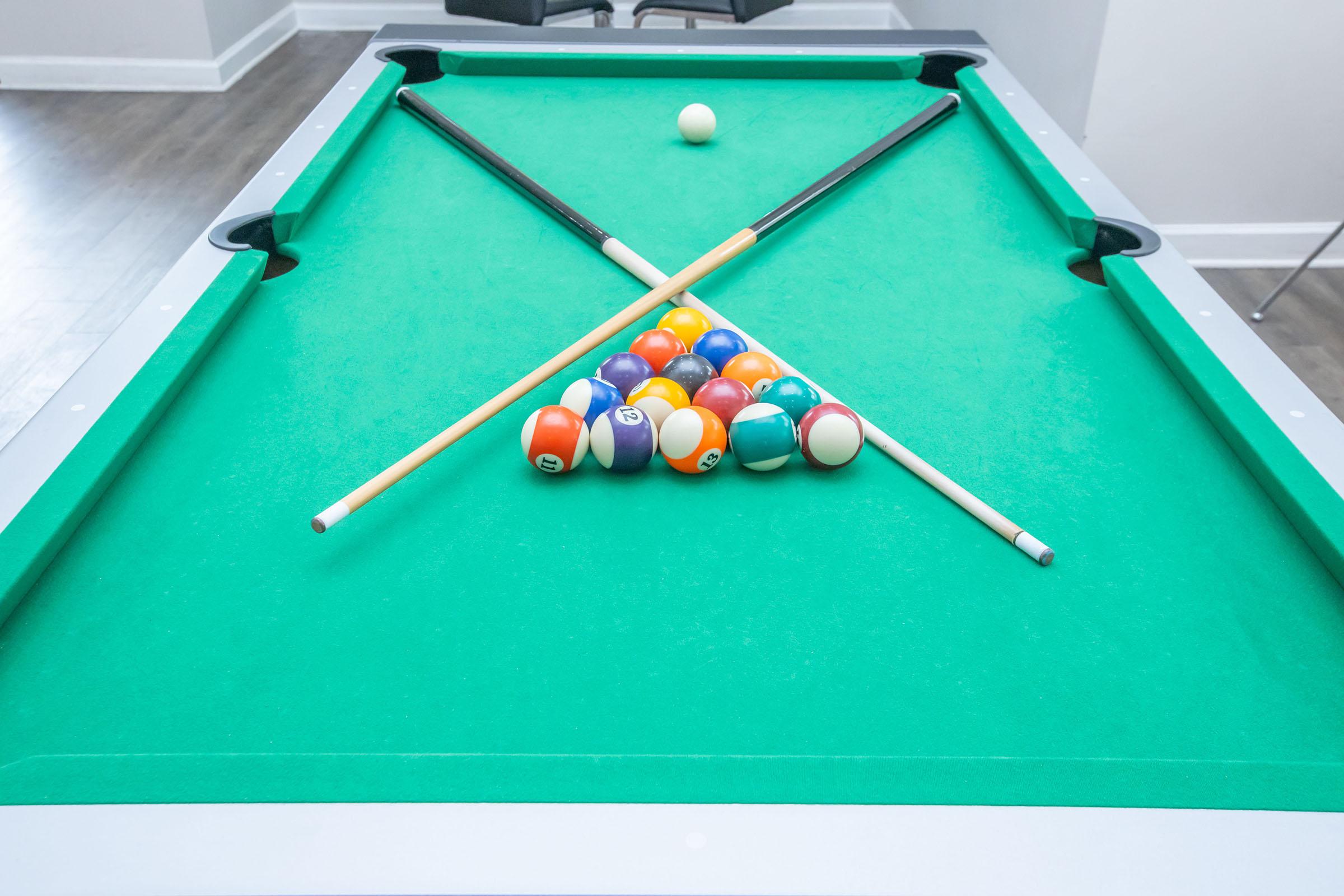 a group of people sitting at a table with a blue ball