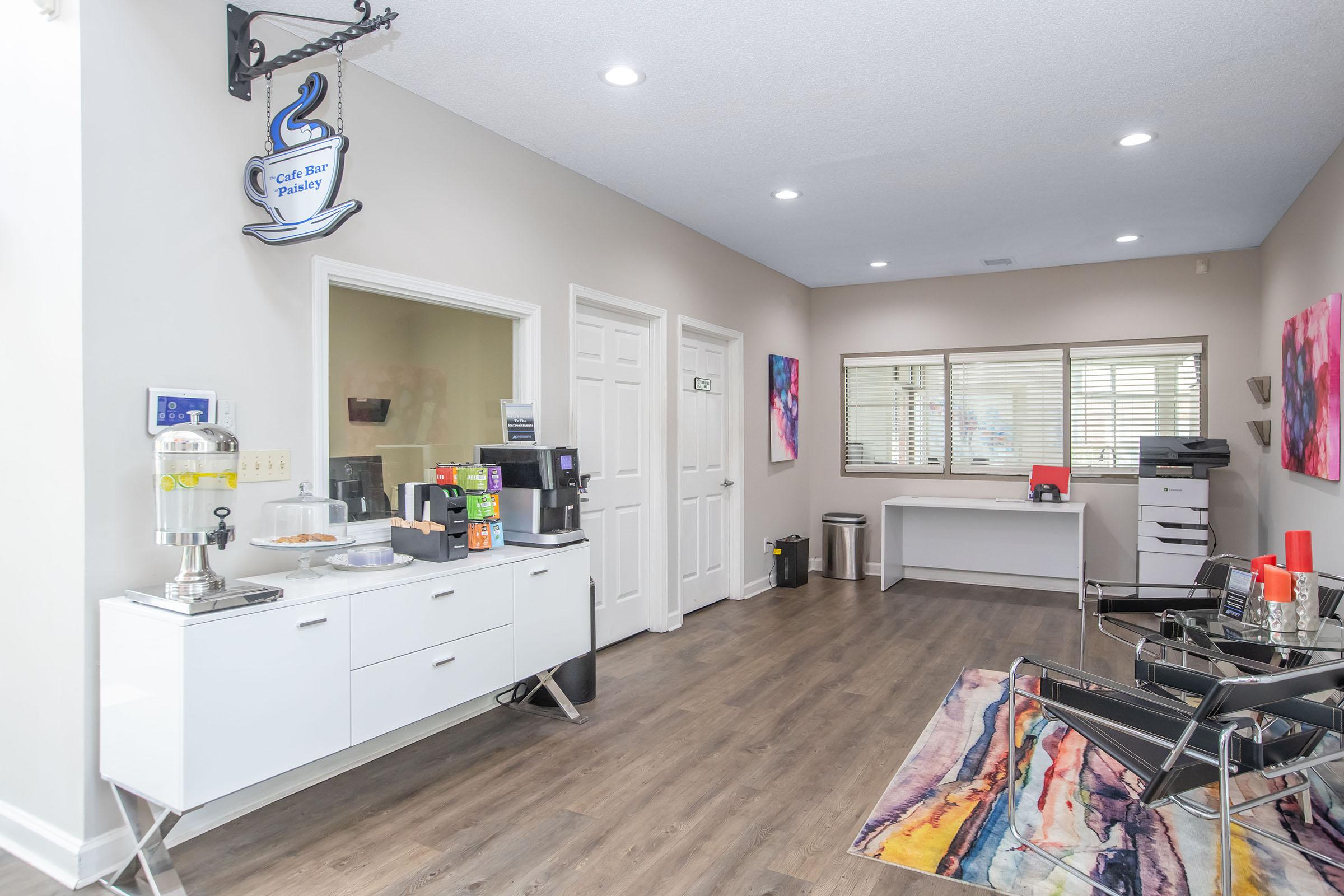 a kitchen filled with lots of furniture