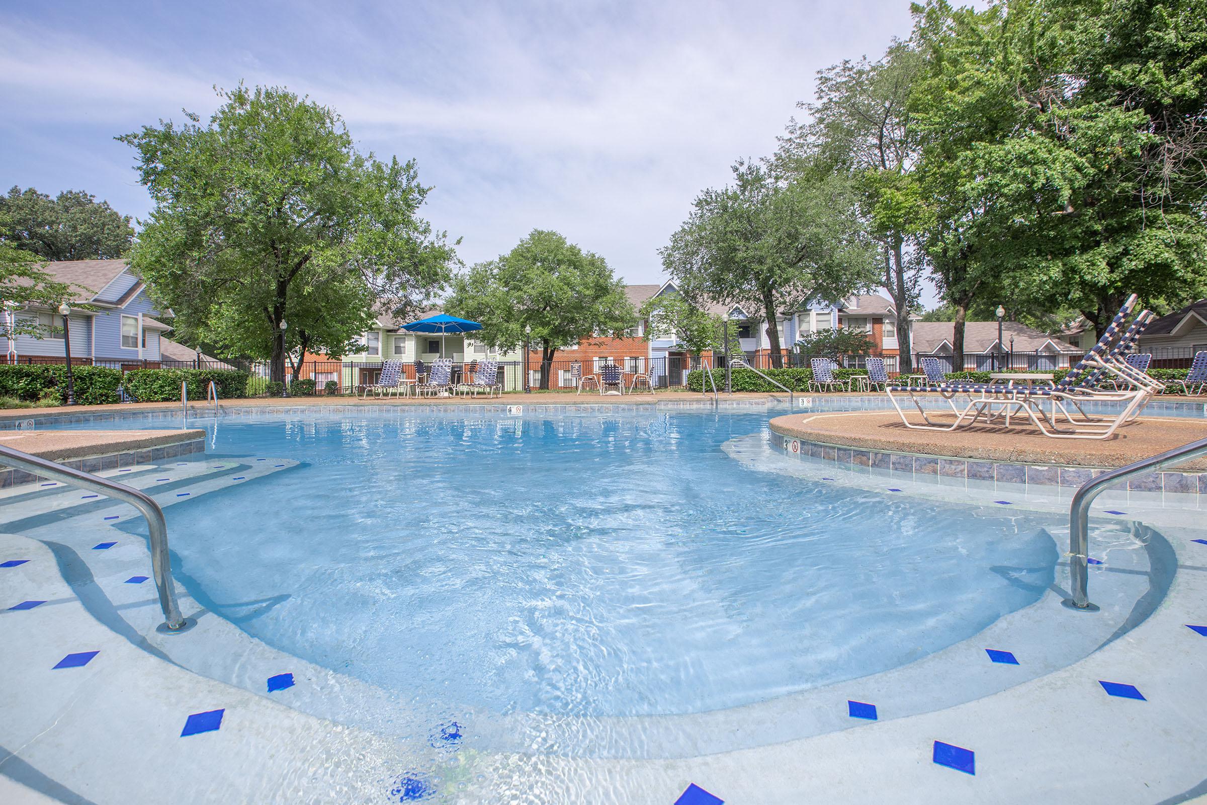 a pool next to a body of water