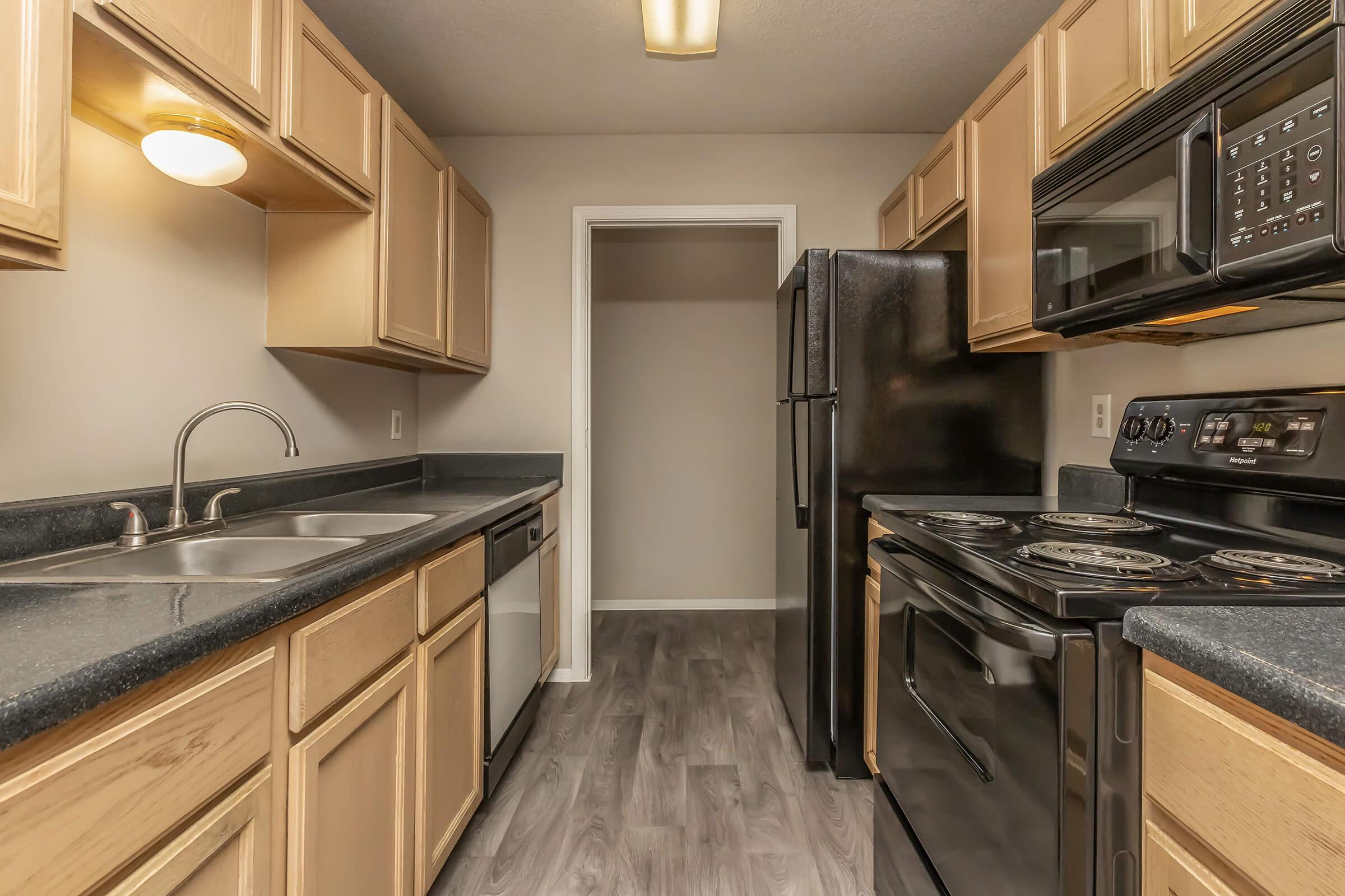 a large kitchen with stainless steel appliances