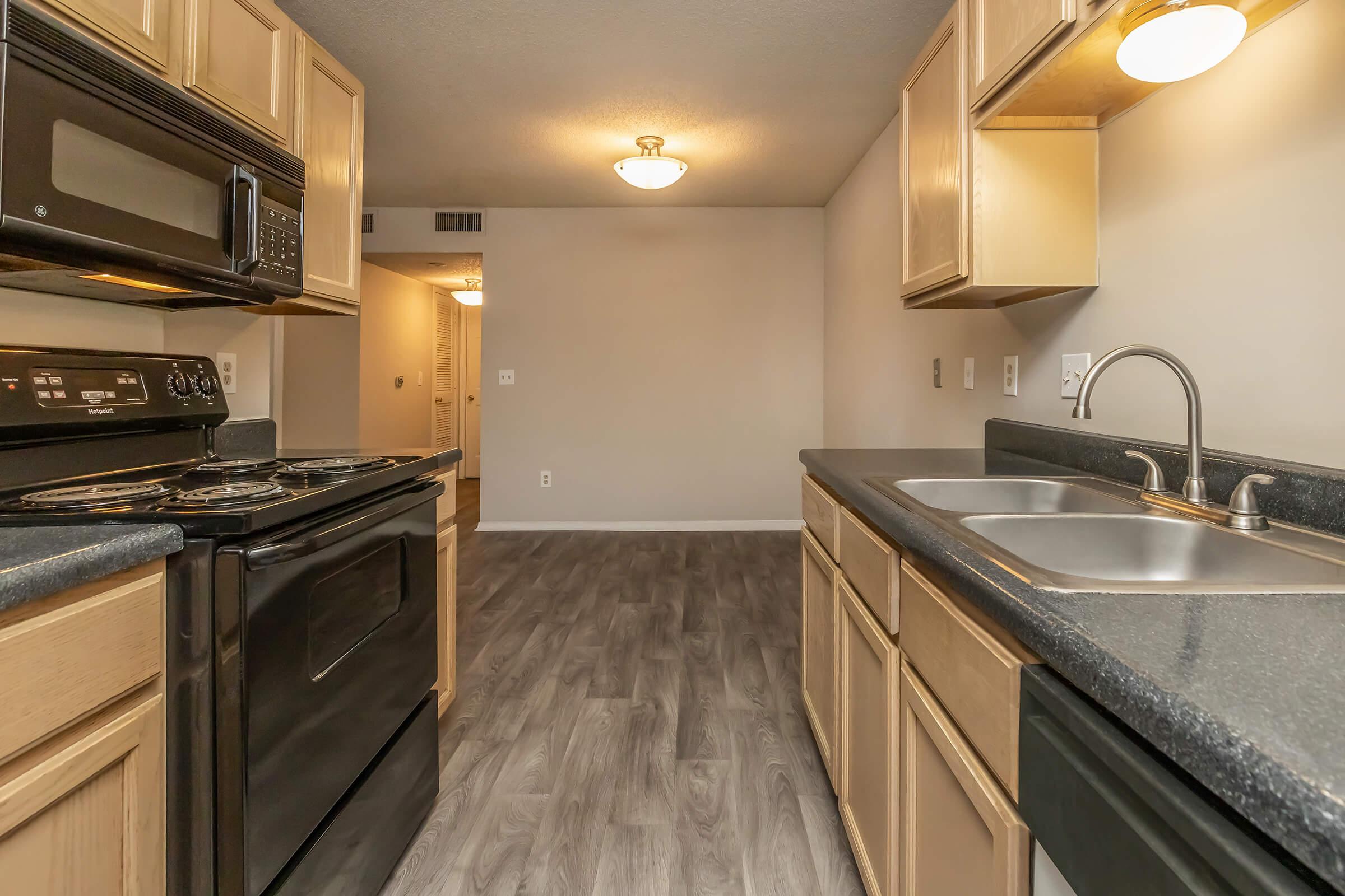 a kitchen with a stove and a sink