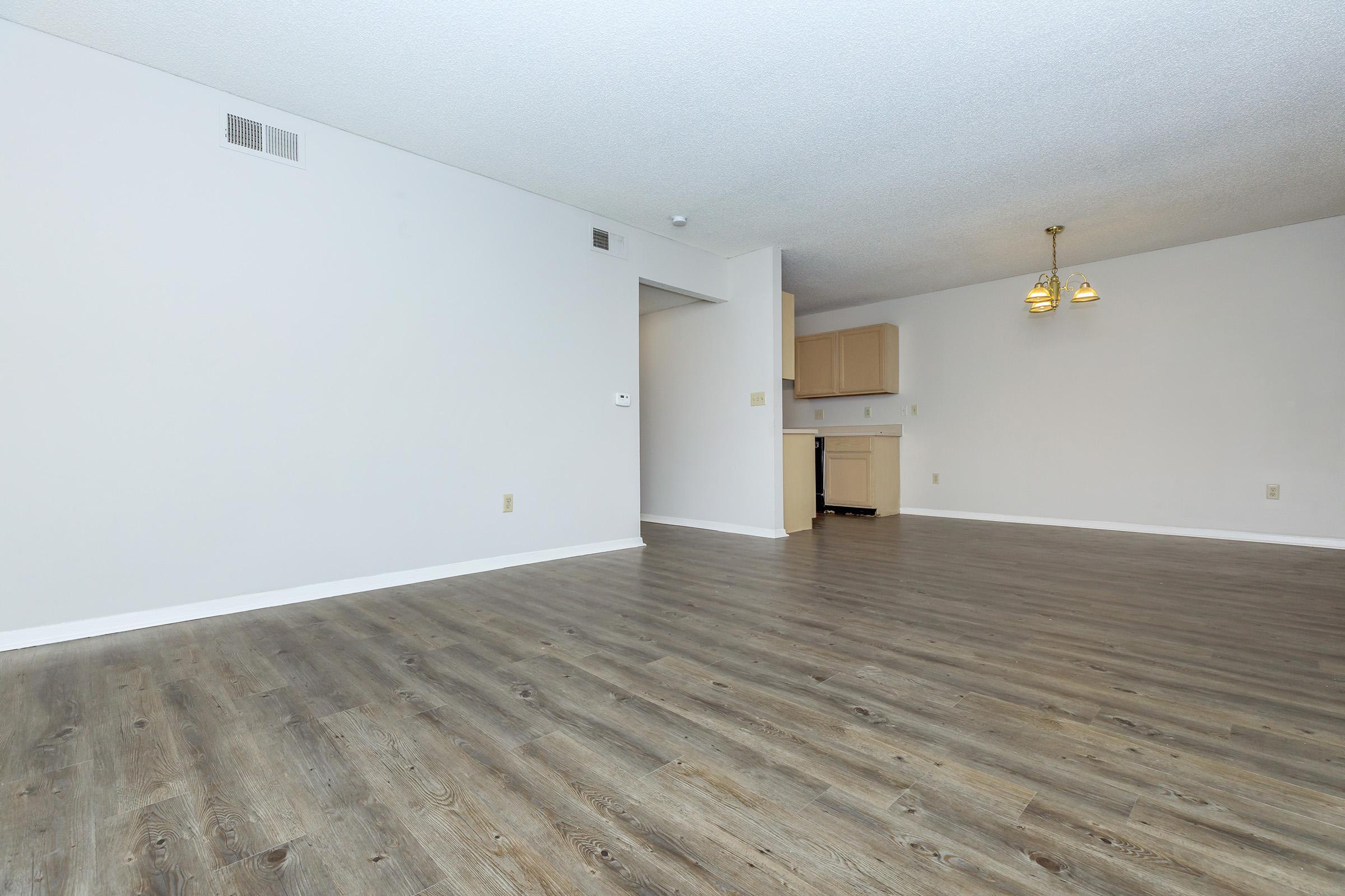 a bedroom with a building in the background