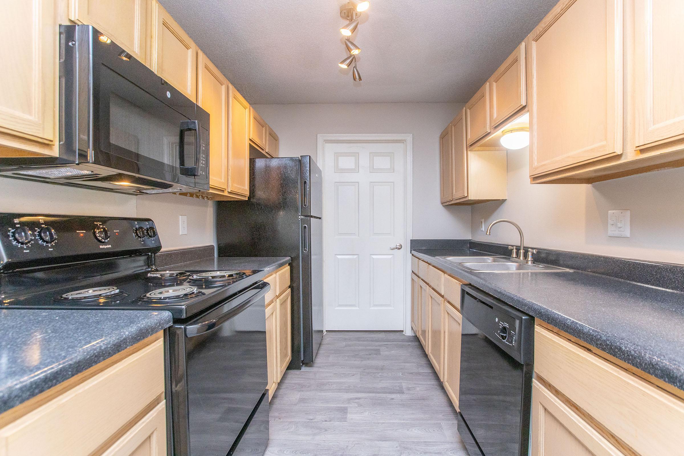 a kitchen with a stove top oven