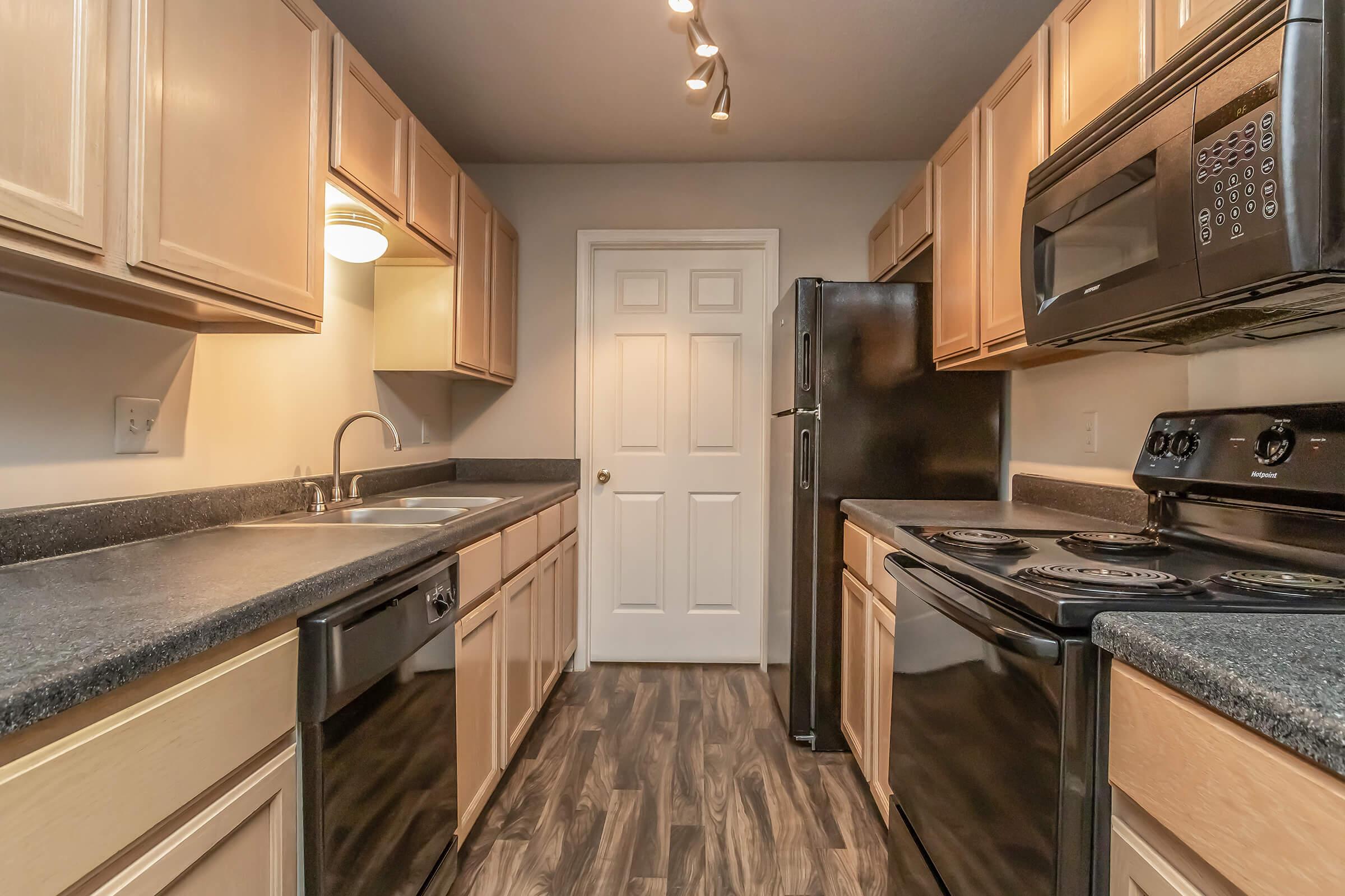 a modern kitchen with stainless steel appliances