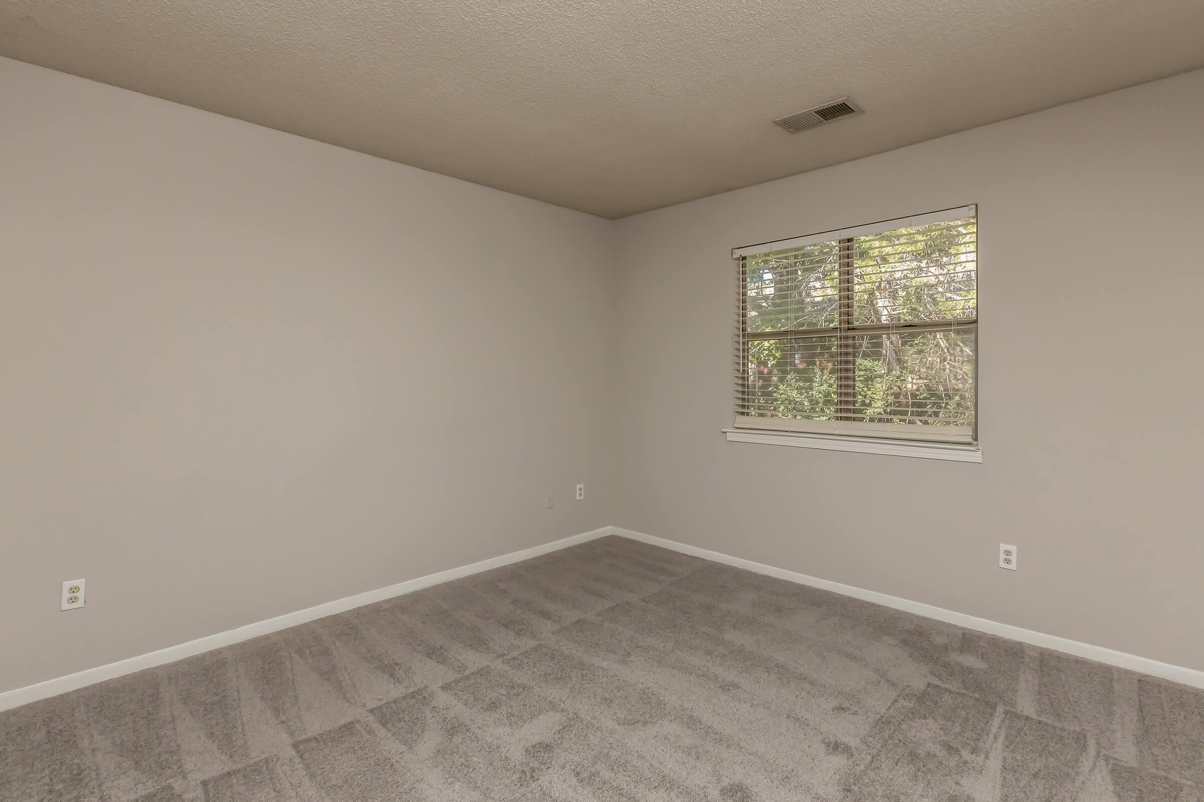 a bedroom with a tile floor