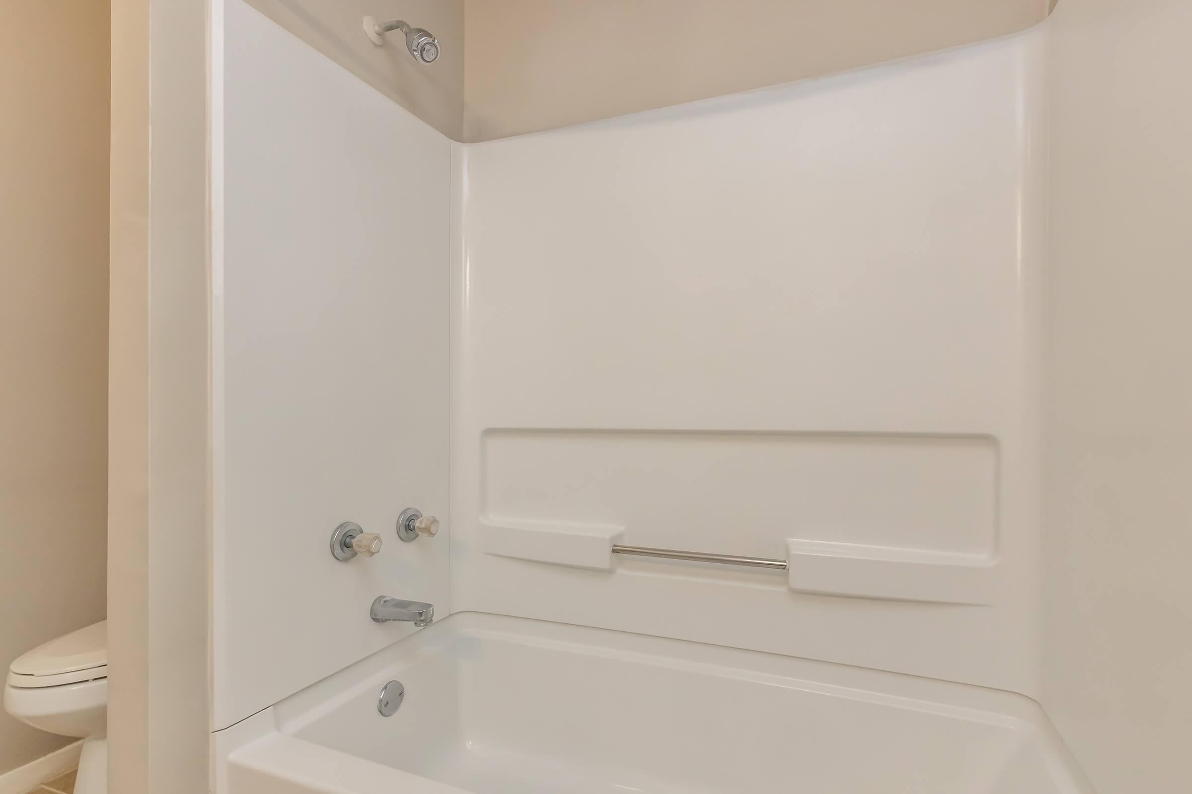 a room with a sink and a bath tub