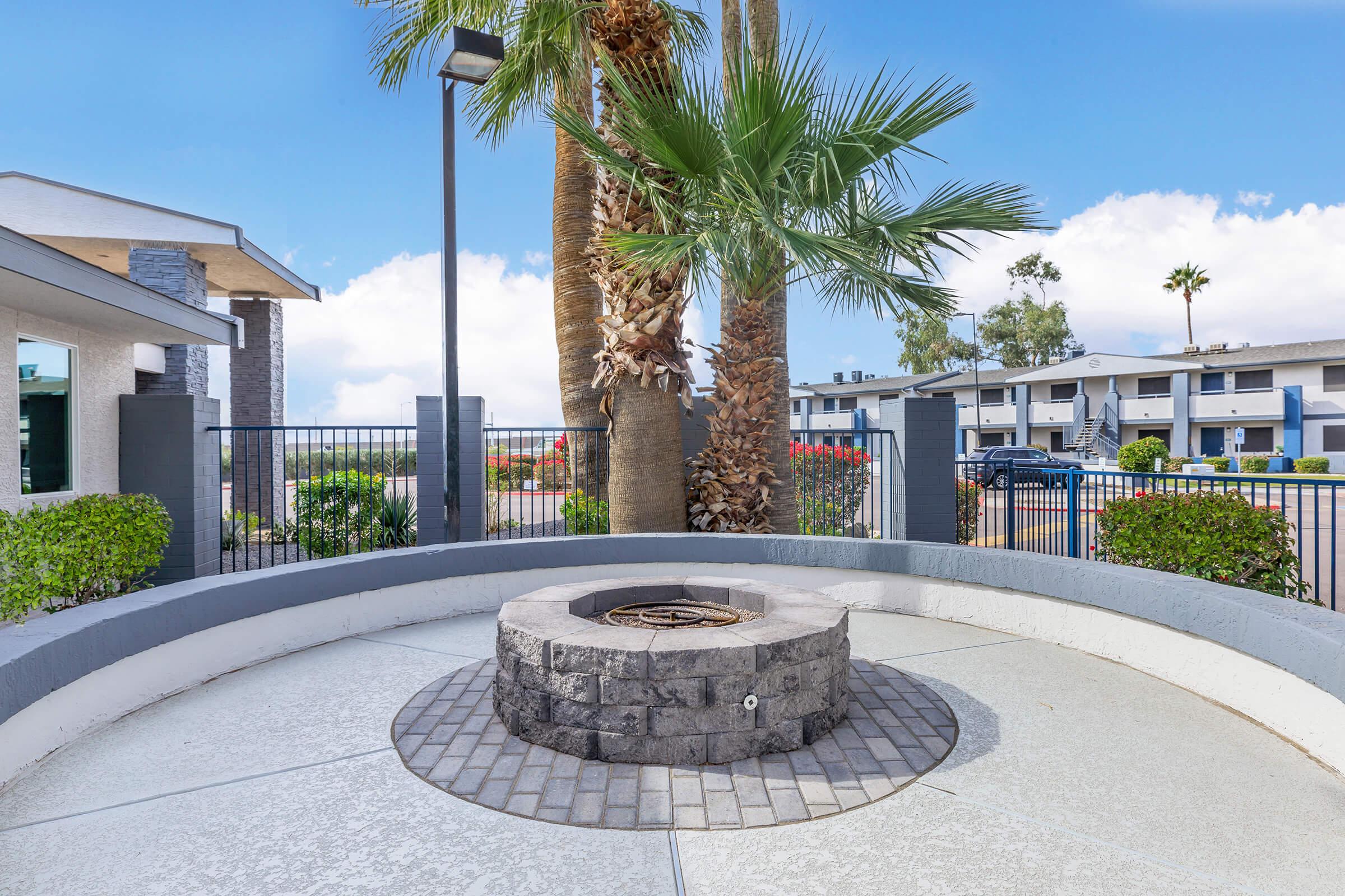 a palm tree in front of a building