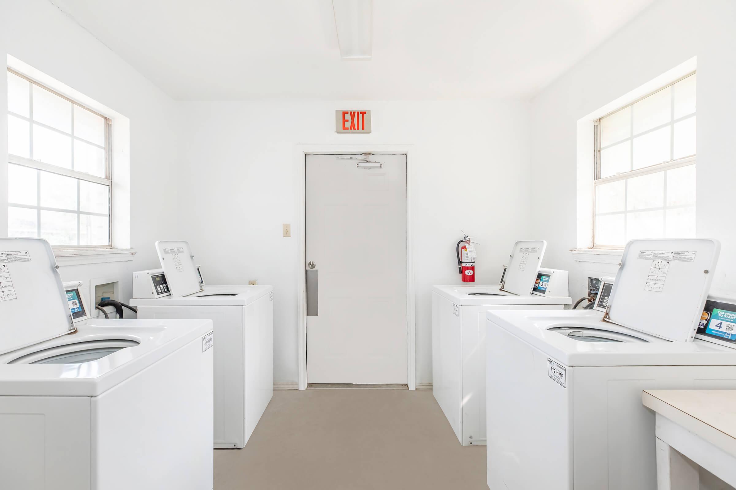 a kitchen with a sink and a refrigerator