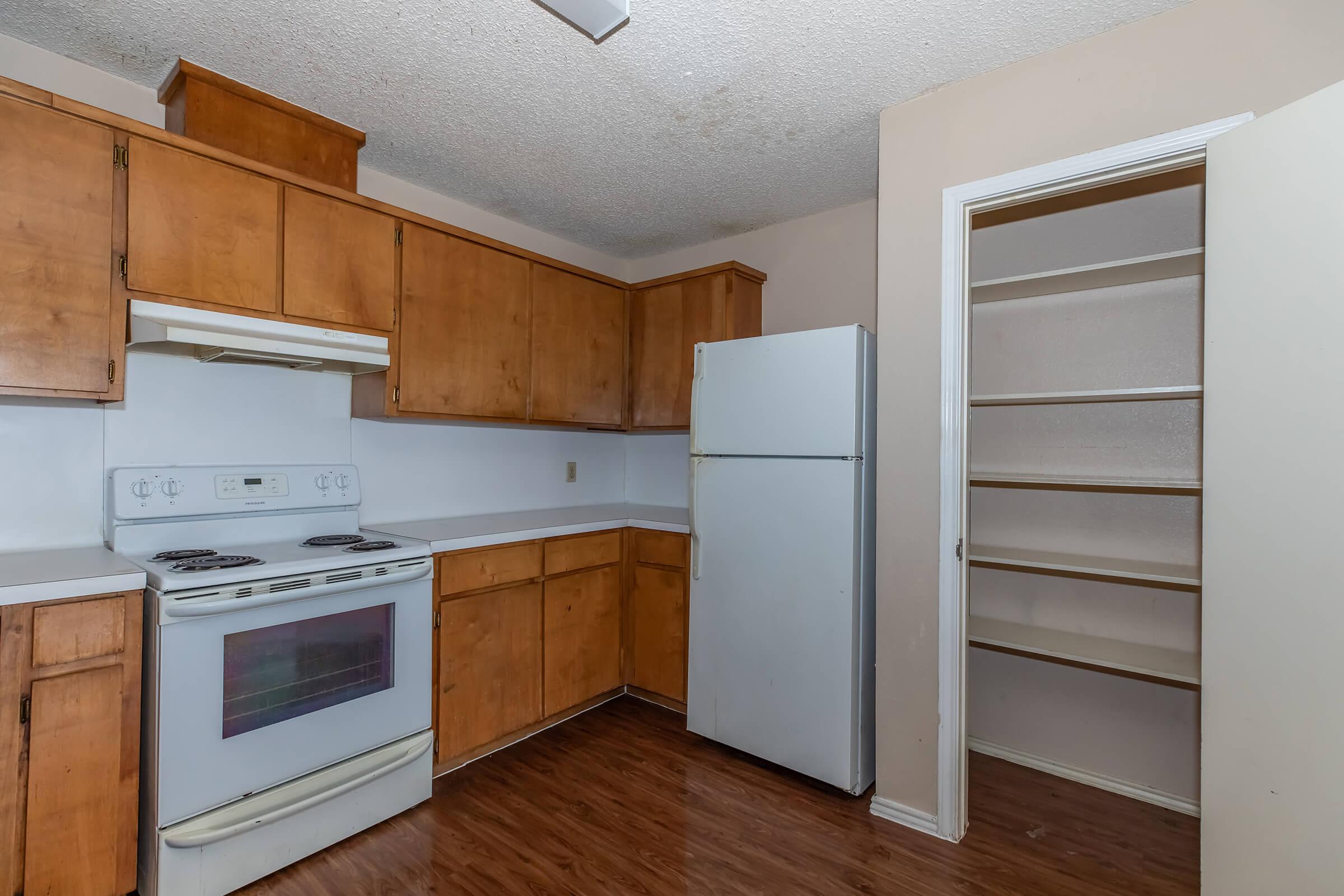 a kitchen with a stove top oven sitting inside of a refrigerator