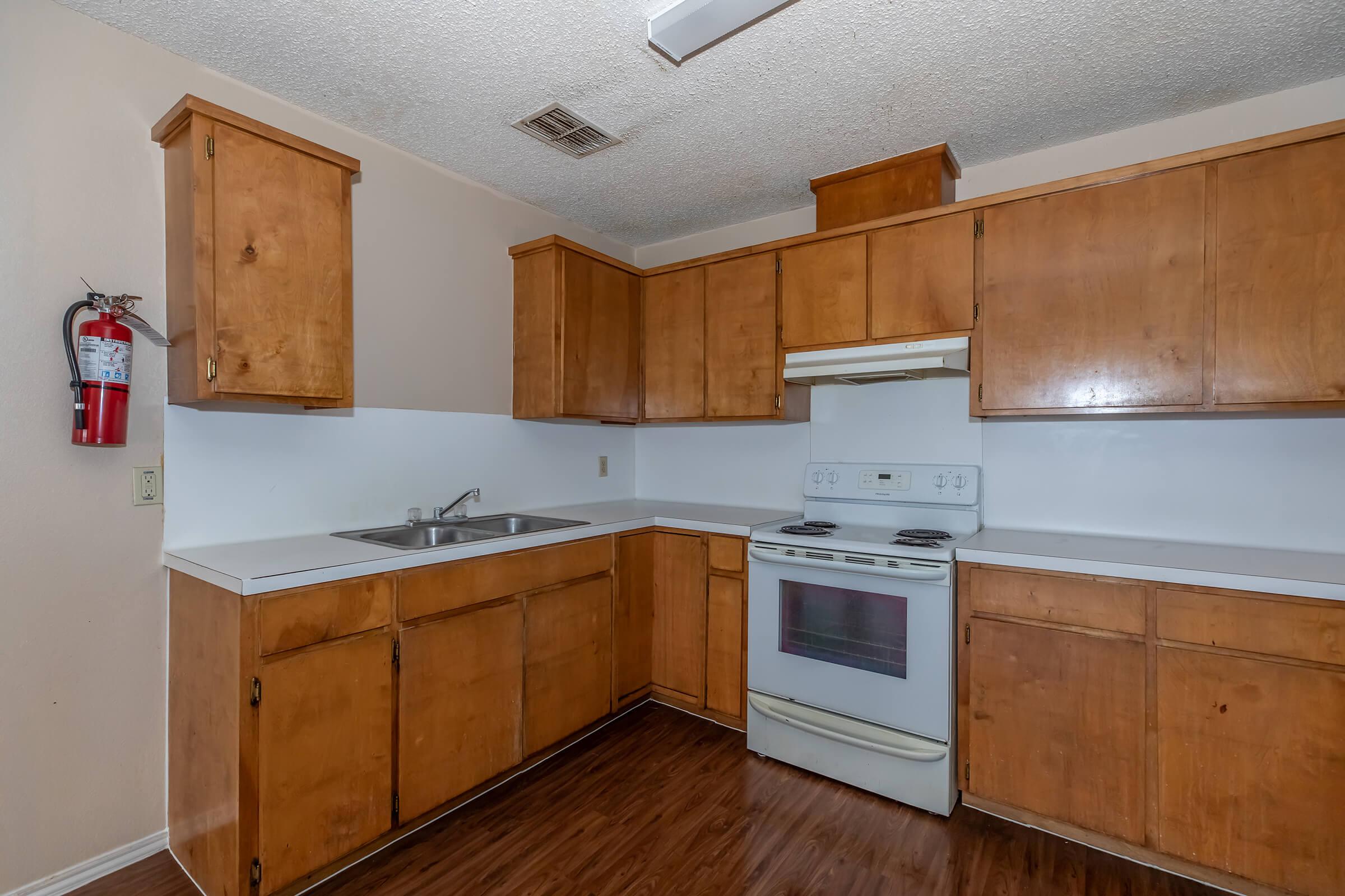 a kitchen with a stove and a refrigerator