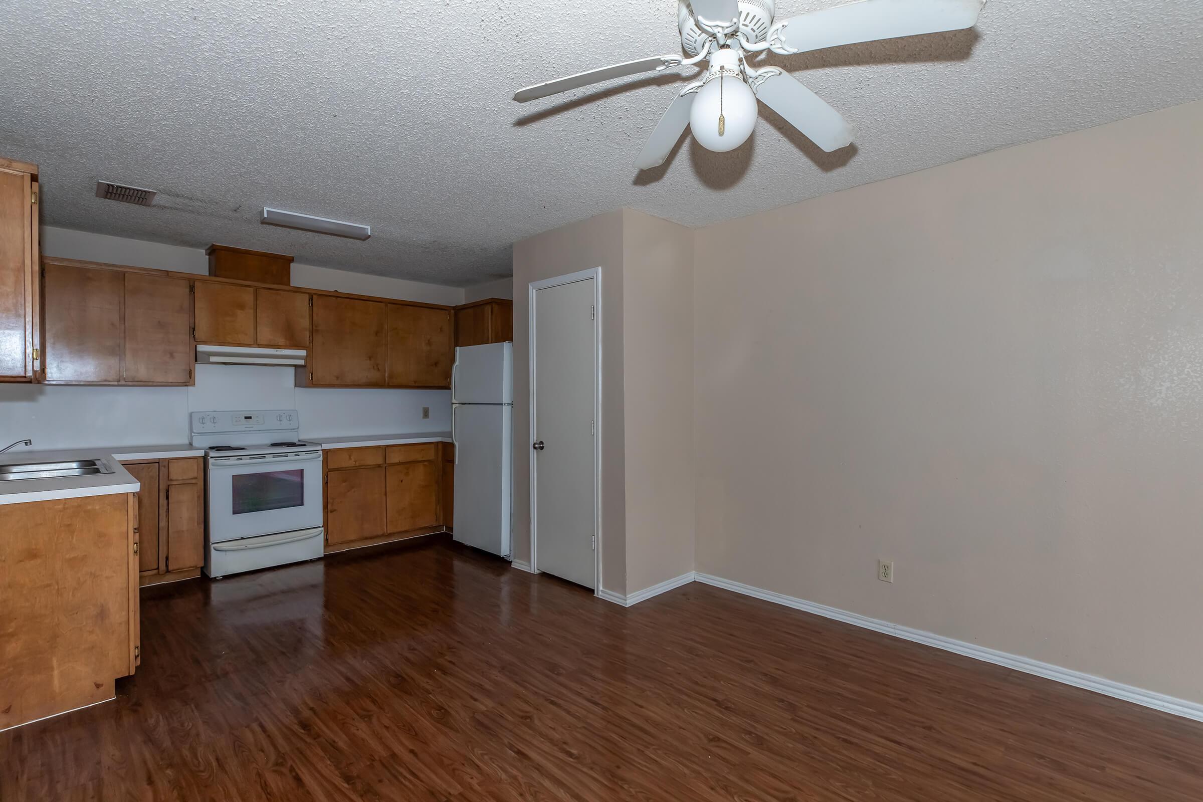 a kitchen with a wood floor