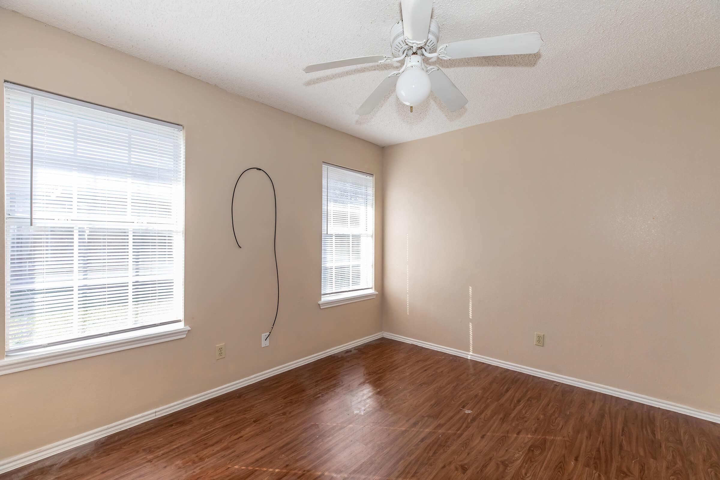 a room filled with furniture and a large window