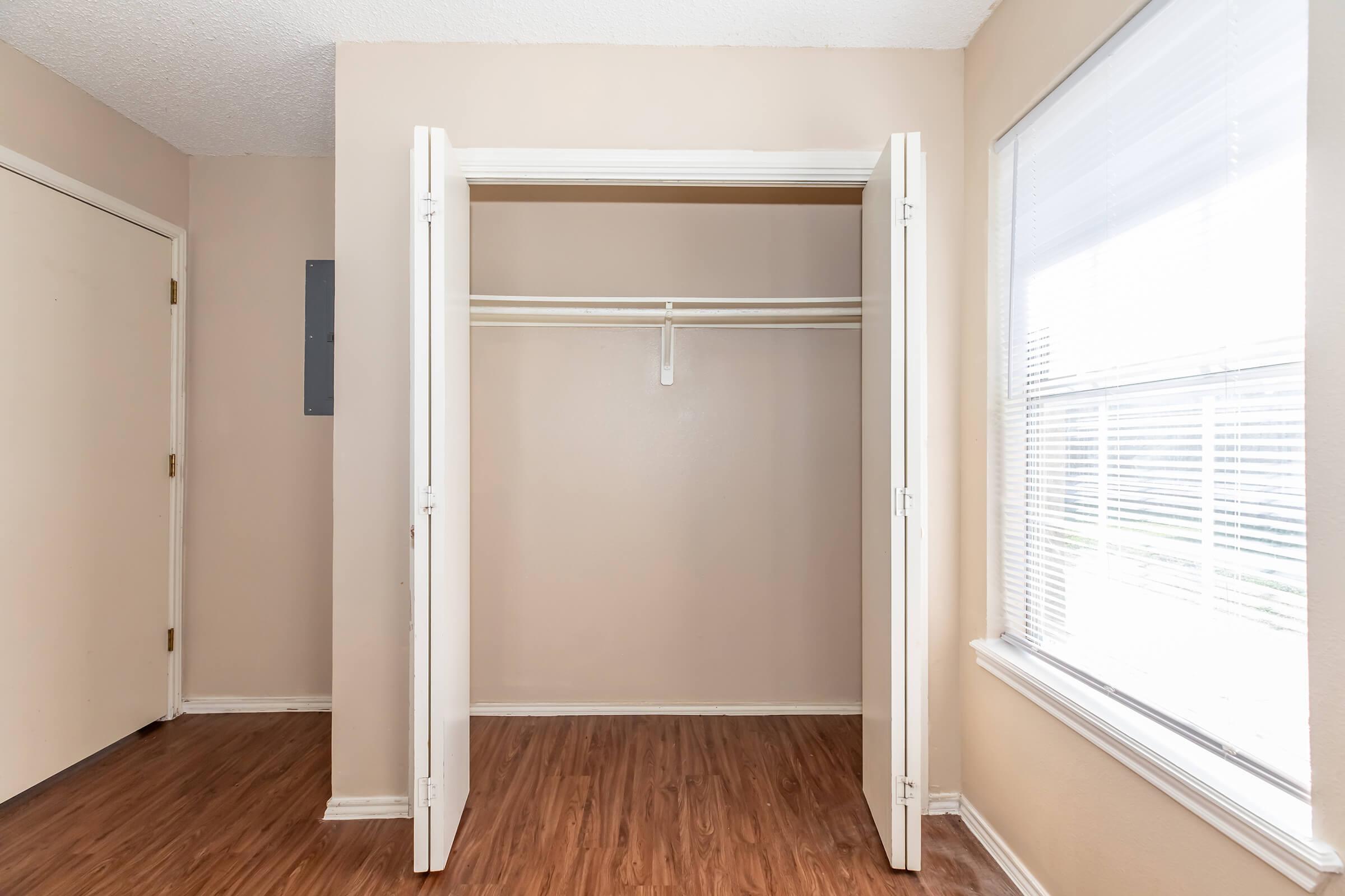 a large empty room with a wooden floor