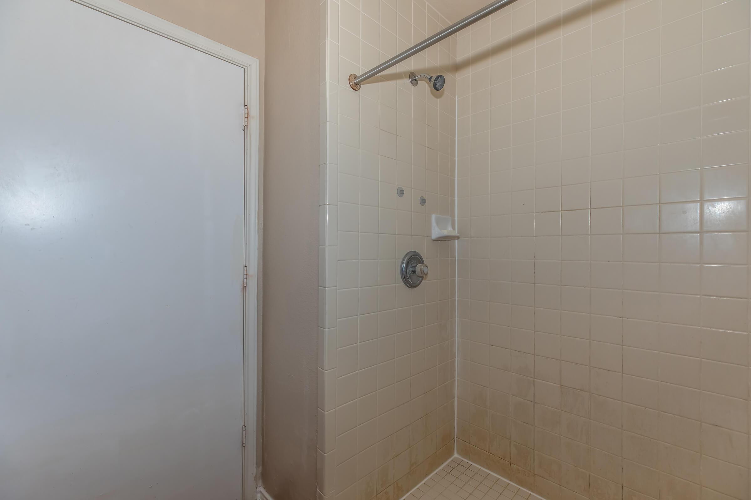 a close up of a shower in a small room