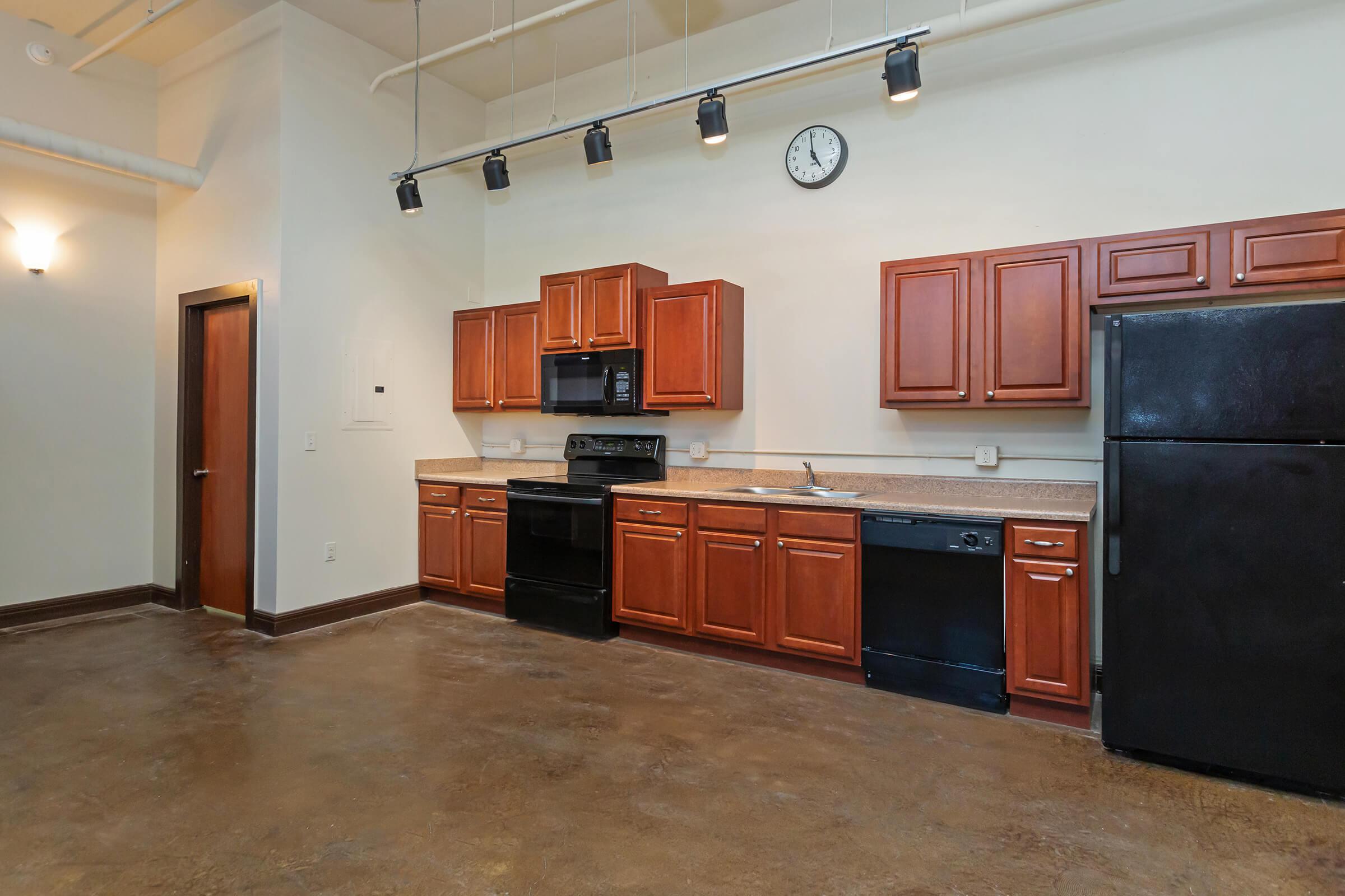 a kitchen filled with appliances and cabinets