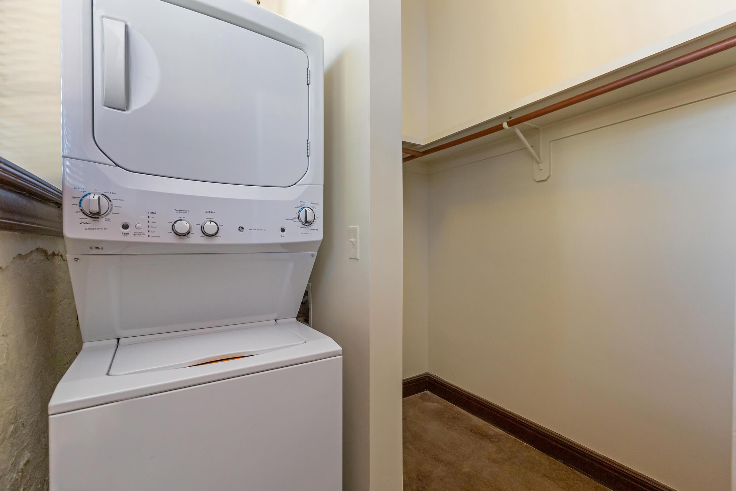 a white refrigerator freezer sitting in a room