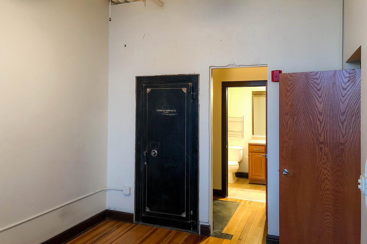 a black refrigerator freezer sitting in a room