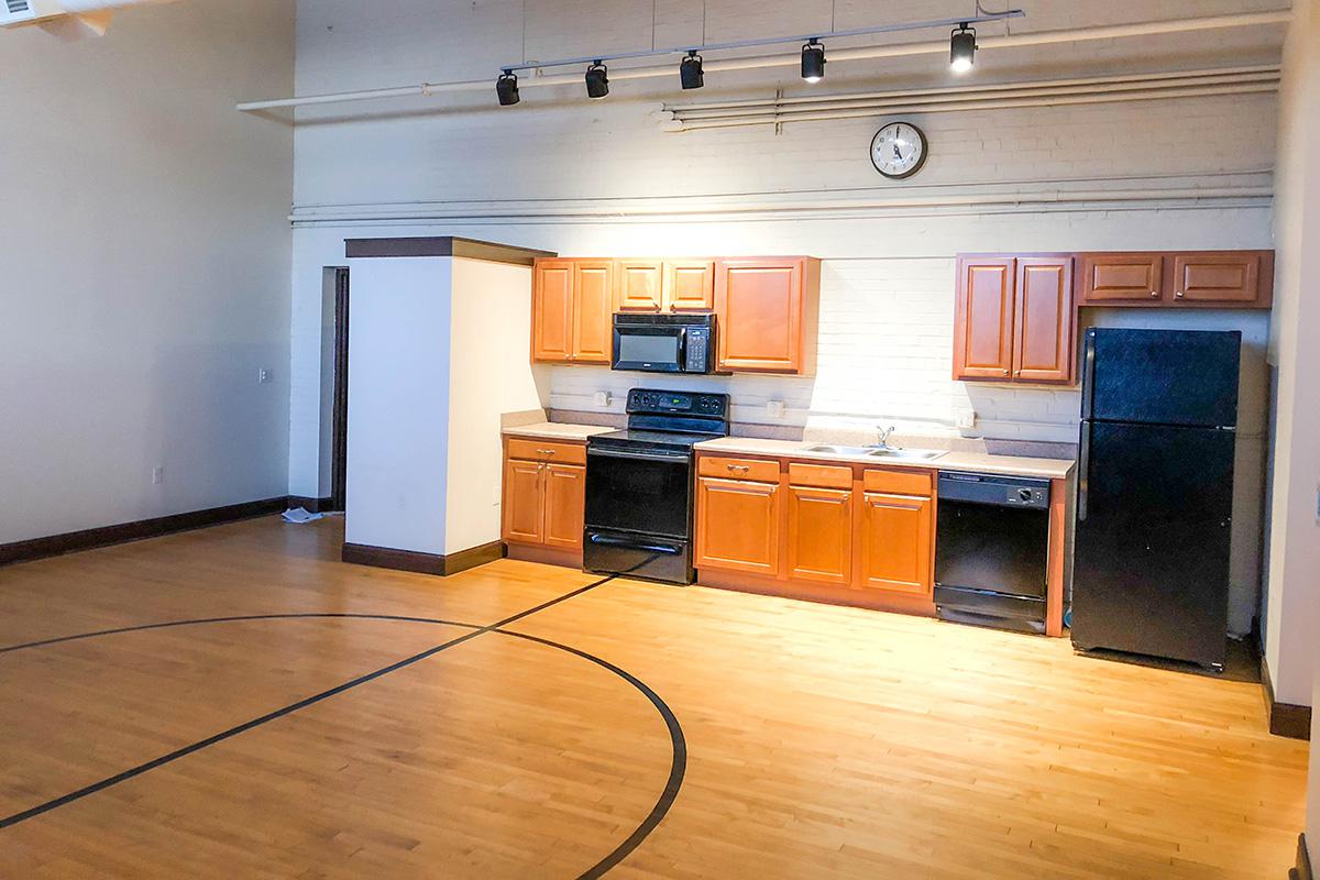 a kitchen with a wood floor