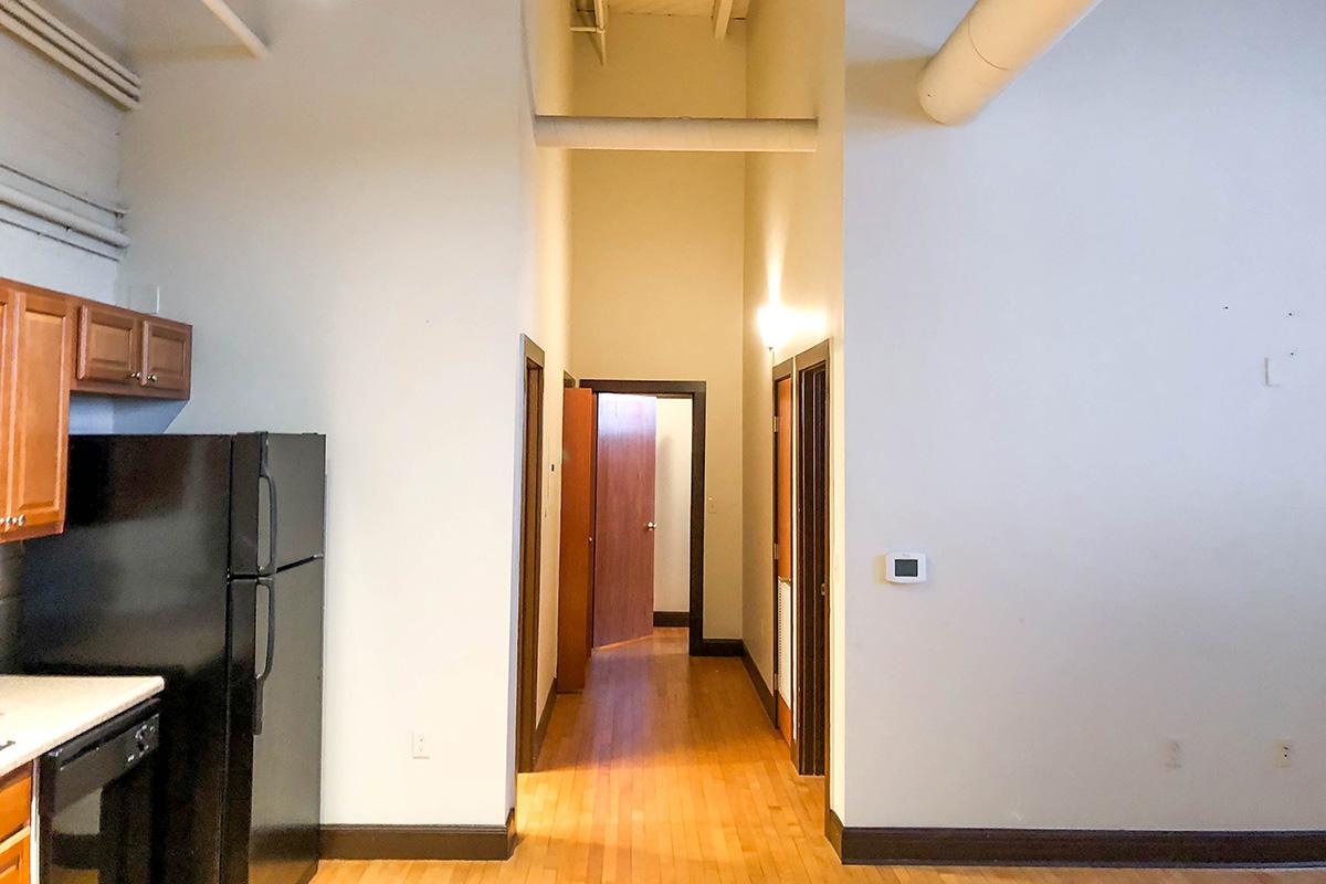 a kitchen with a wood floor