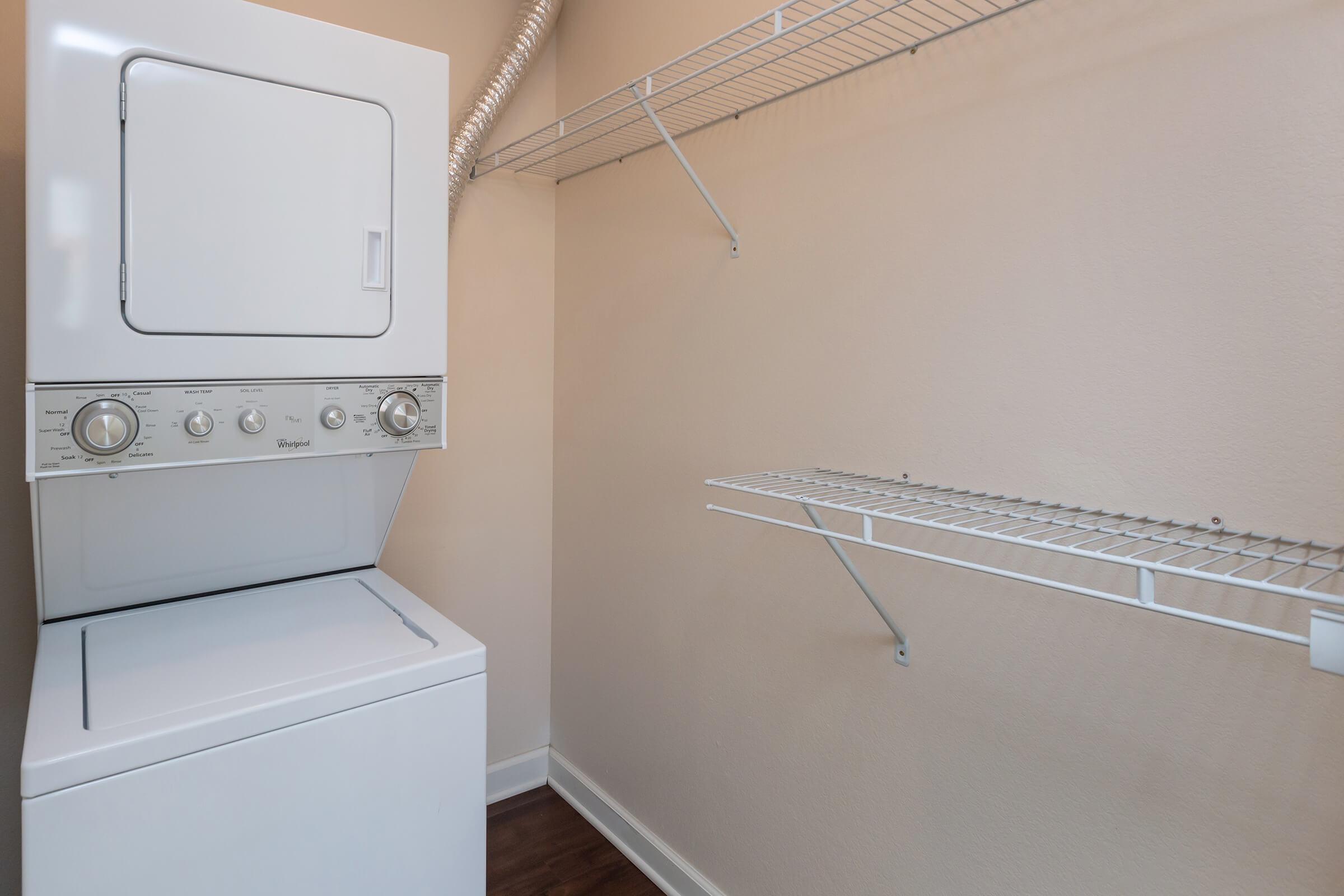 a white refrigerator freezer sitting in a room