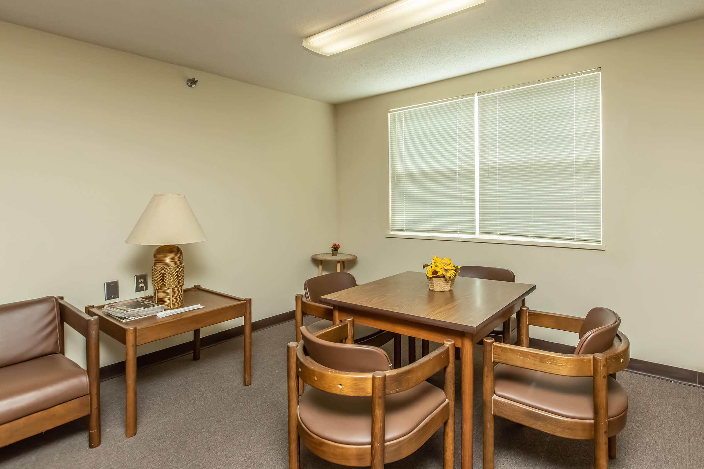 a room filled with furniture and a table