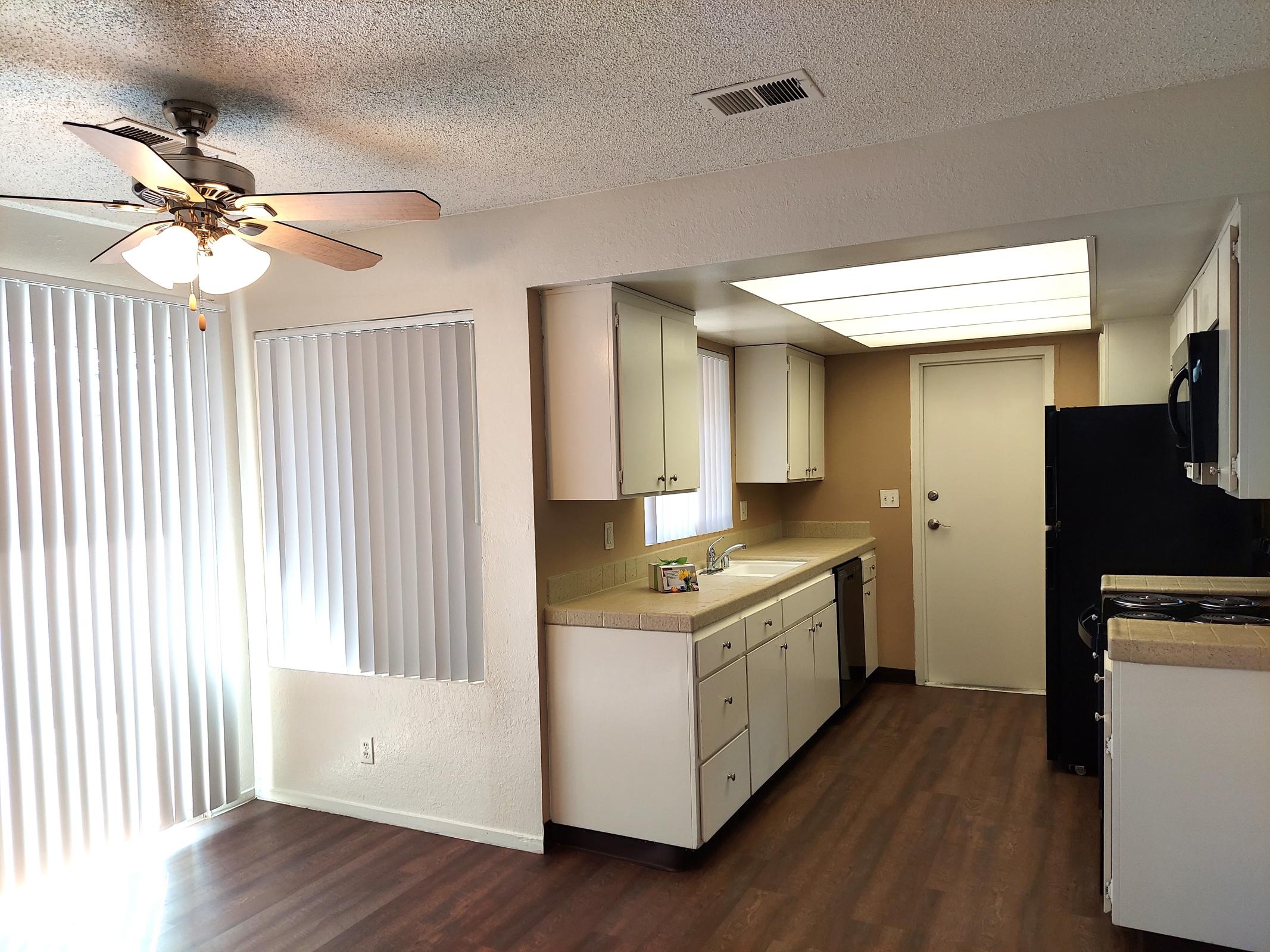 a kitchen with a table in a room