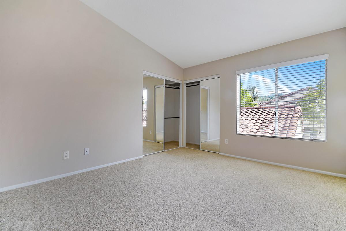 Unfurnished bedroom with carpet