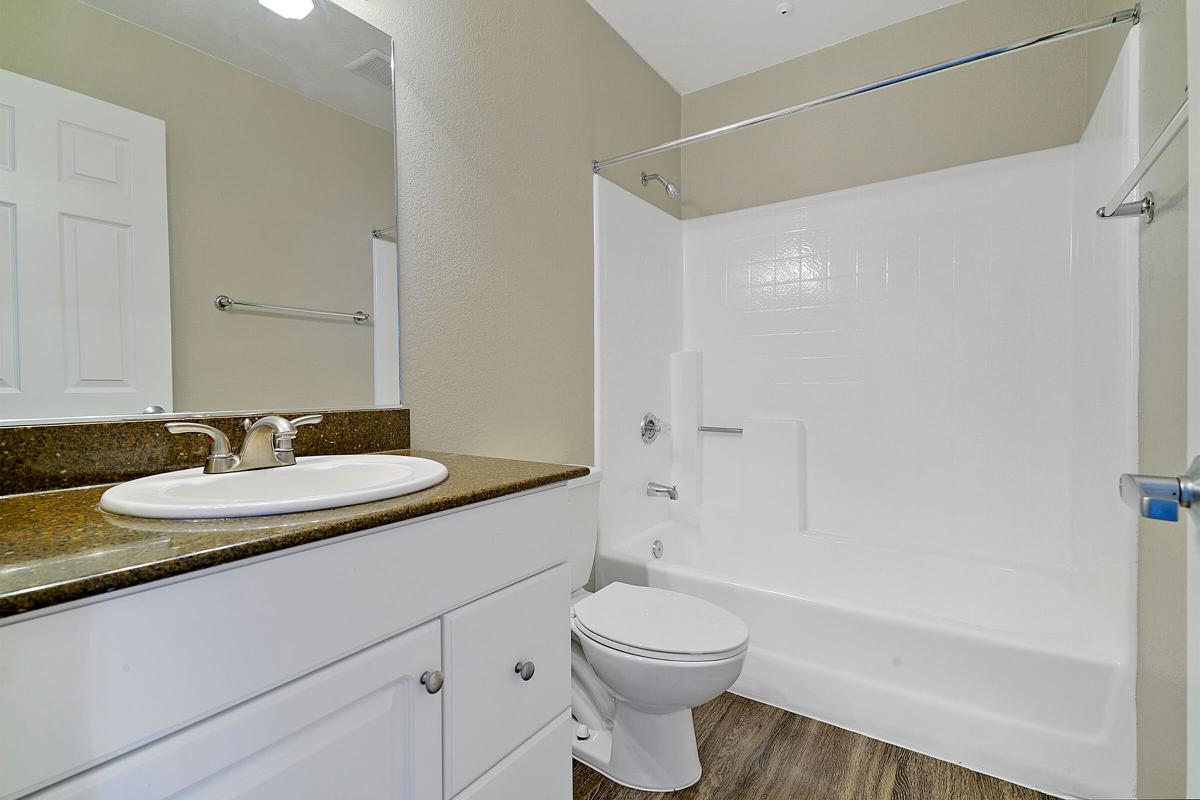 Unfurnished bathroom with wooden floors