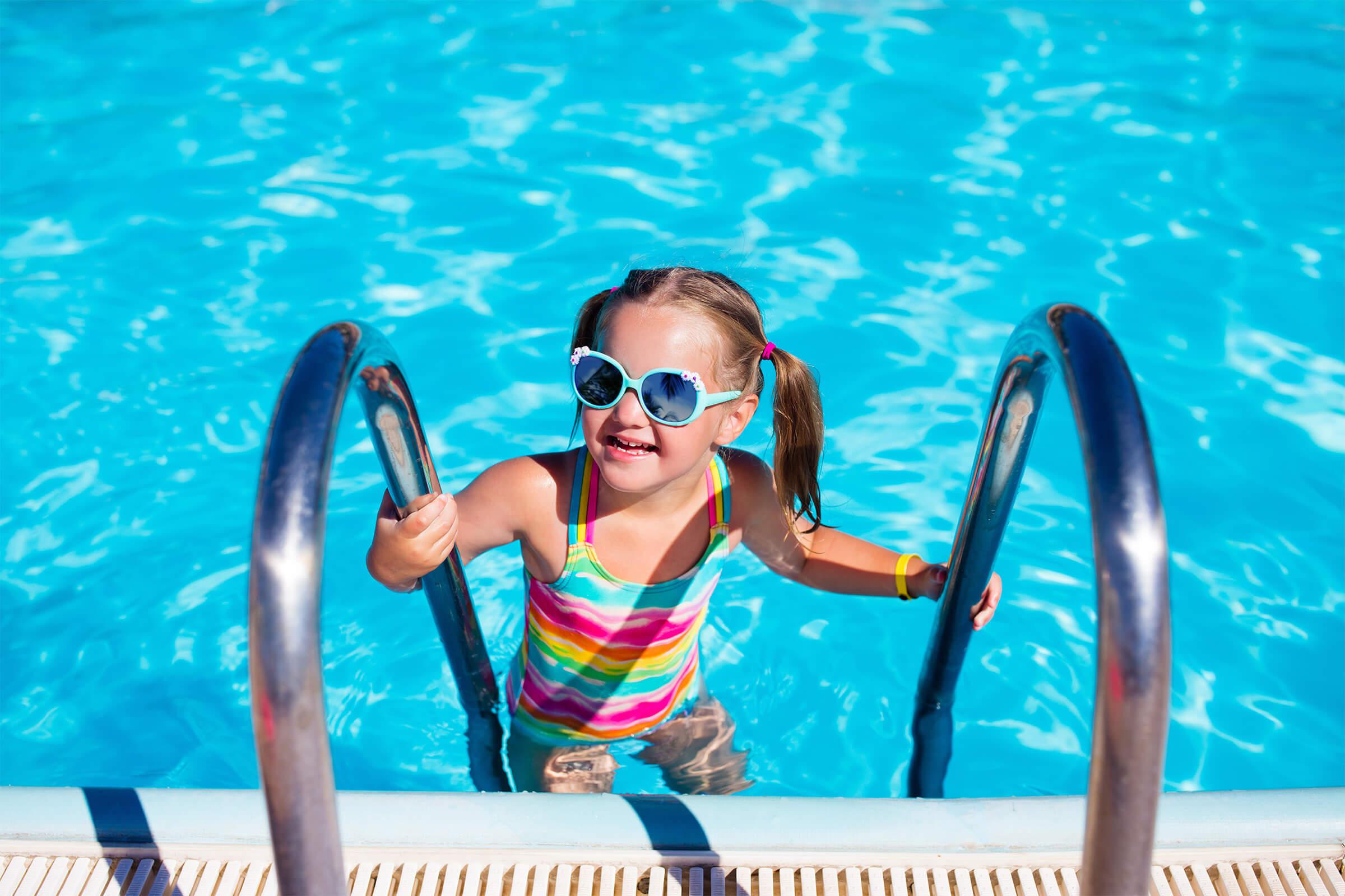 a girl in a pool of water