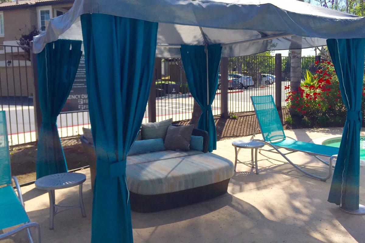 a table topped with a blue umbrella