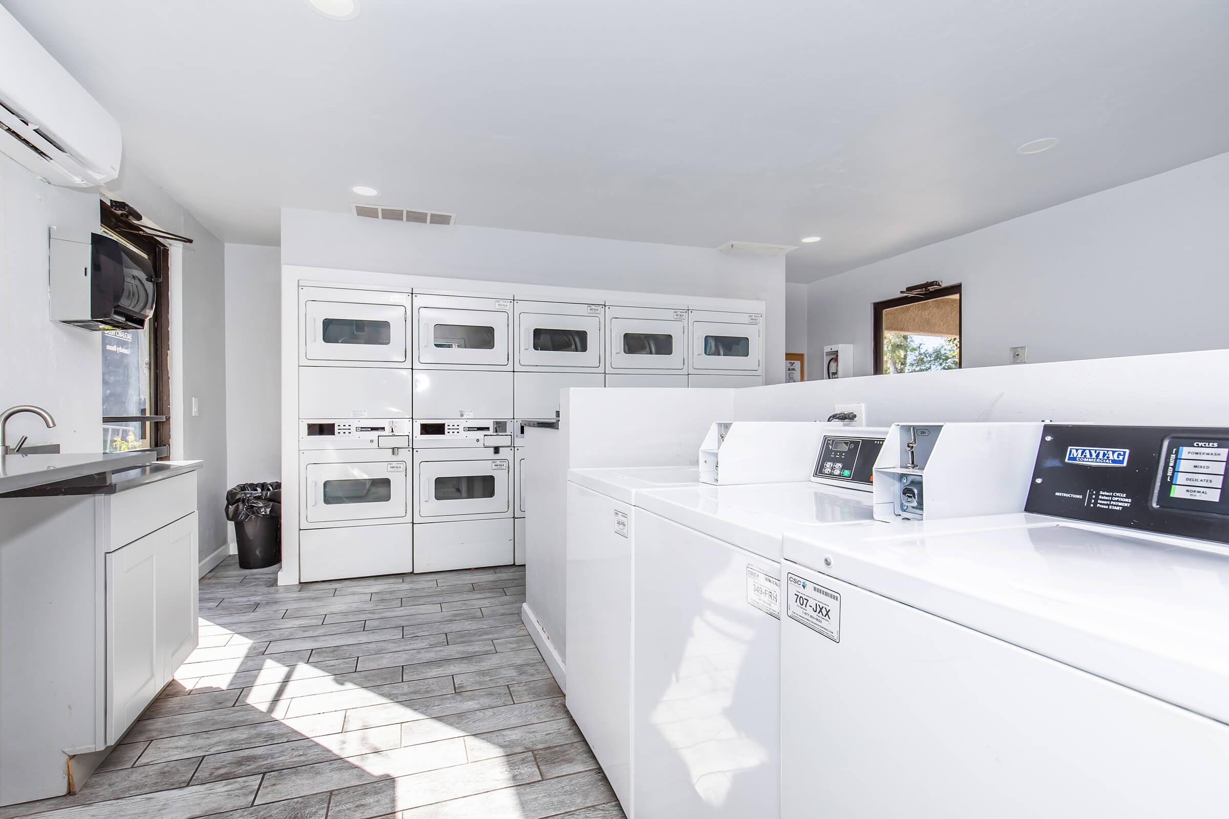 a kitchen with a sink and a refrigerator