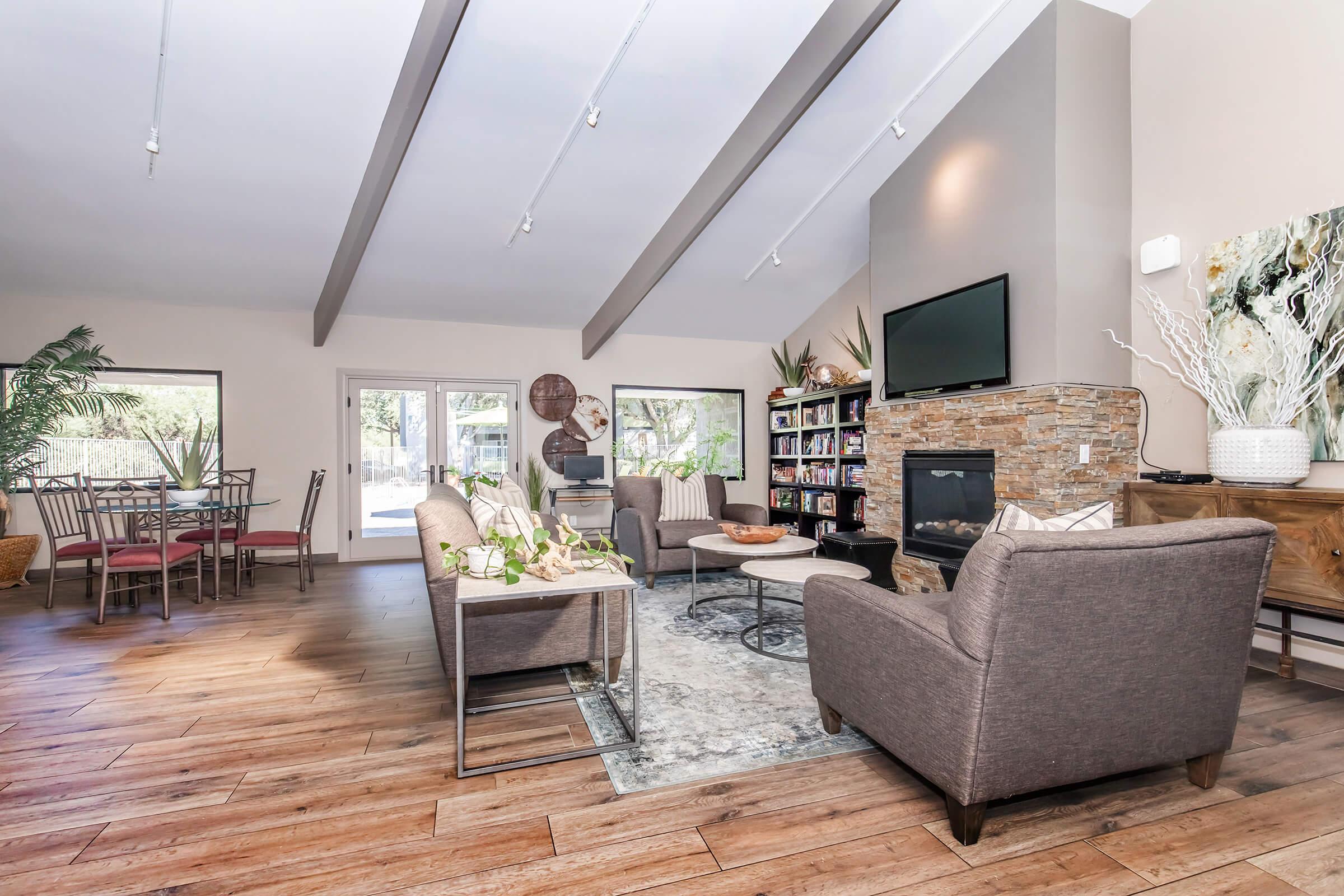 a living room filled with furniture and a fireplace