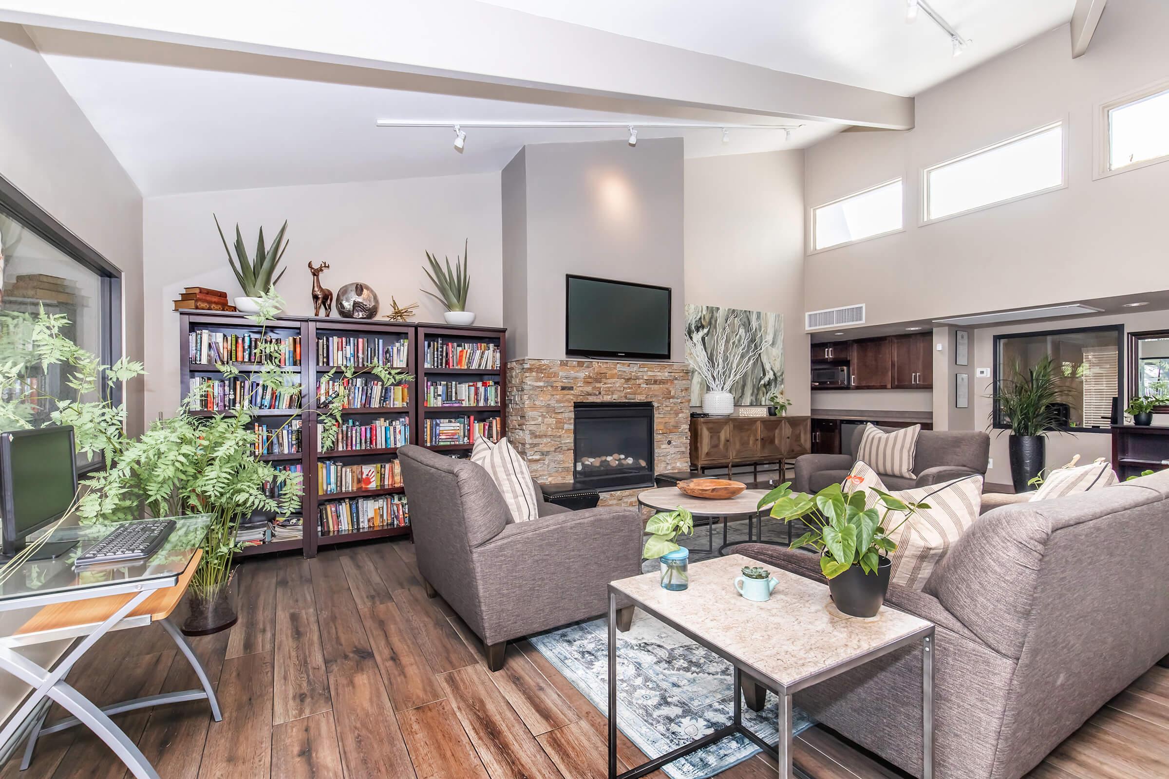 a living room filled with furniture and a fireplace