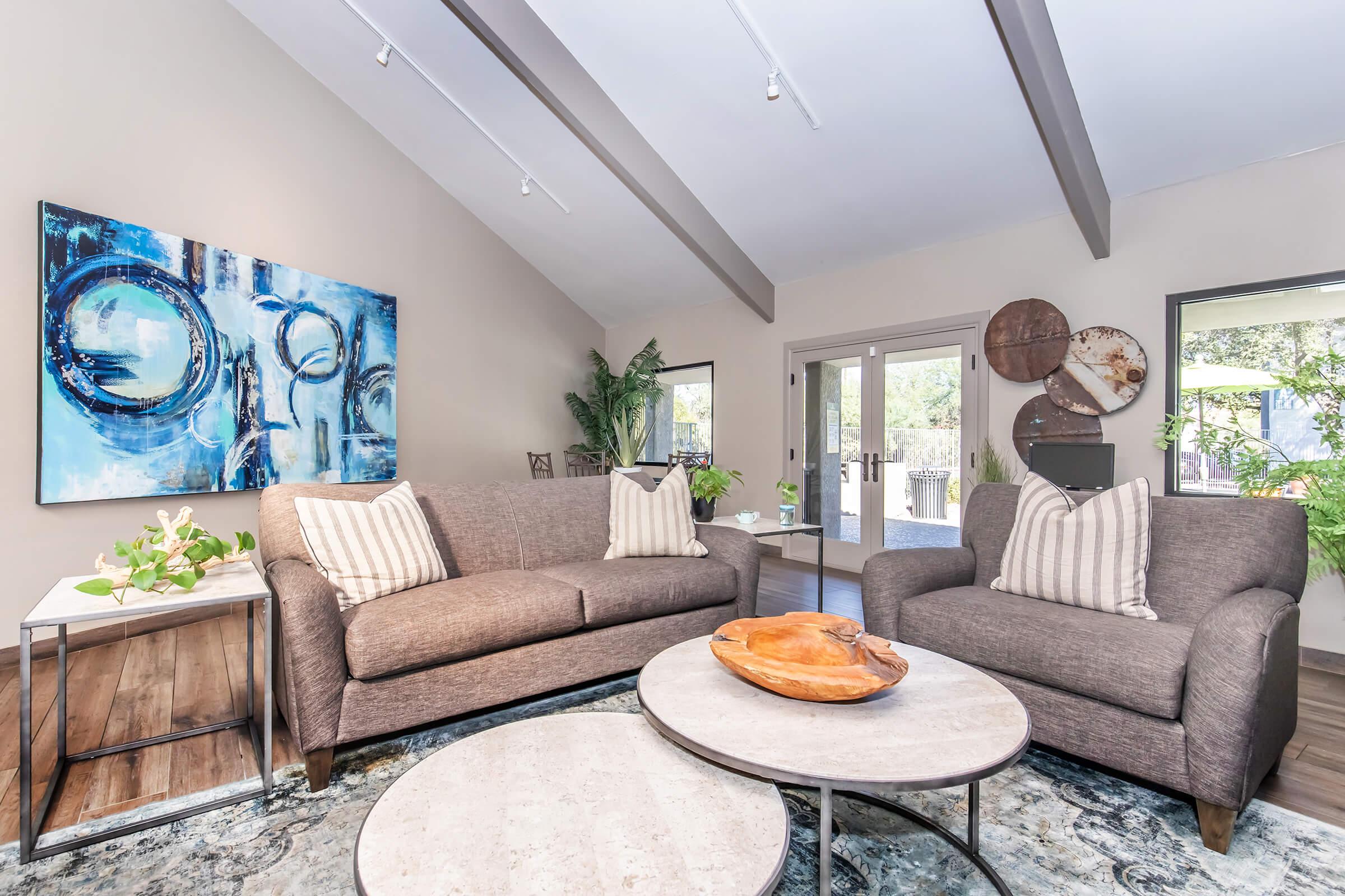 a living room filled with furniture and a fireplace