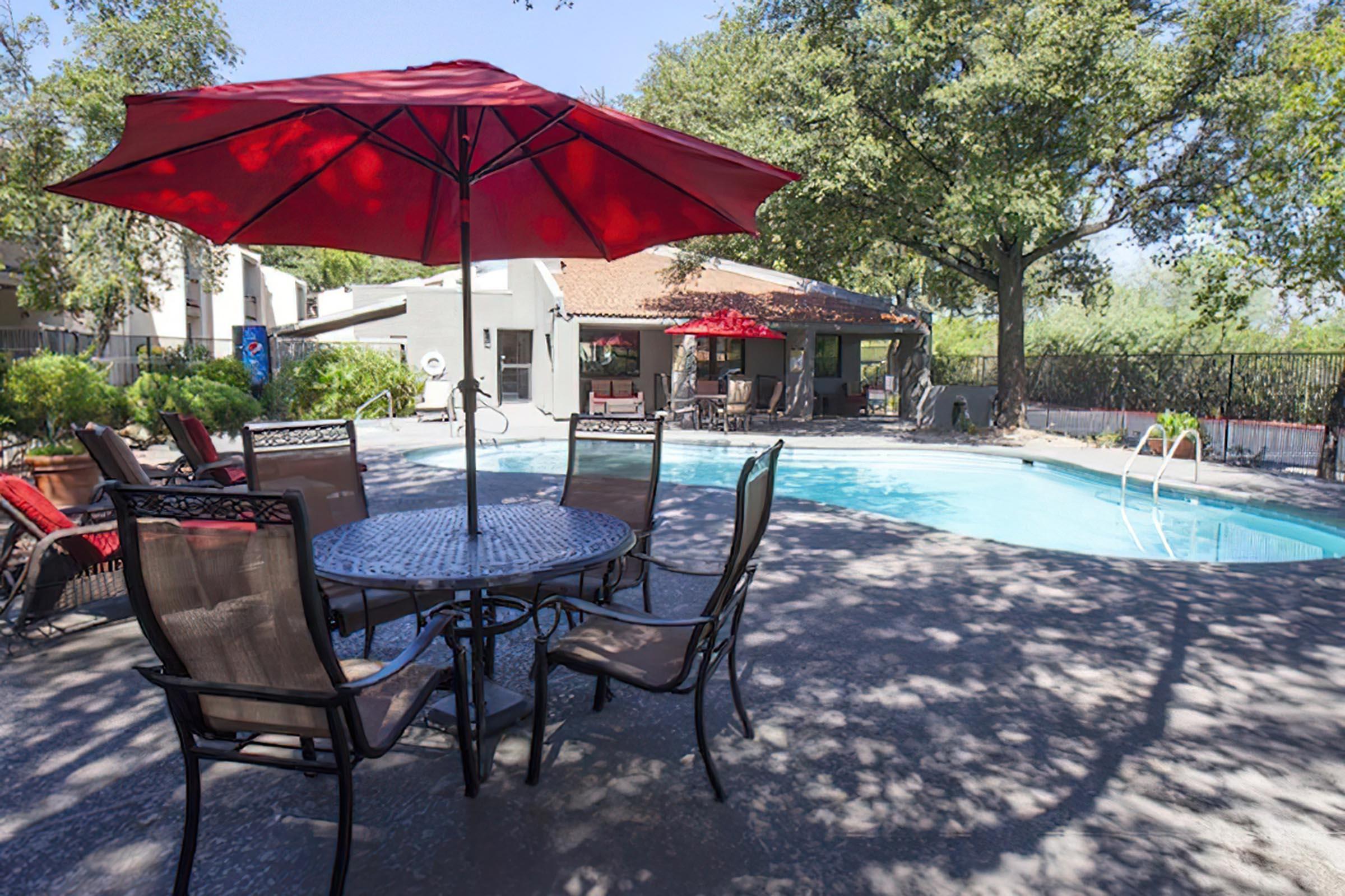 a lawn chair under an umbrella