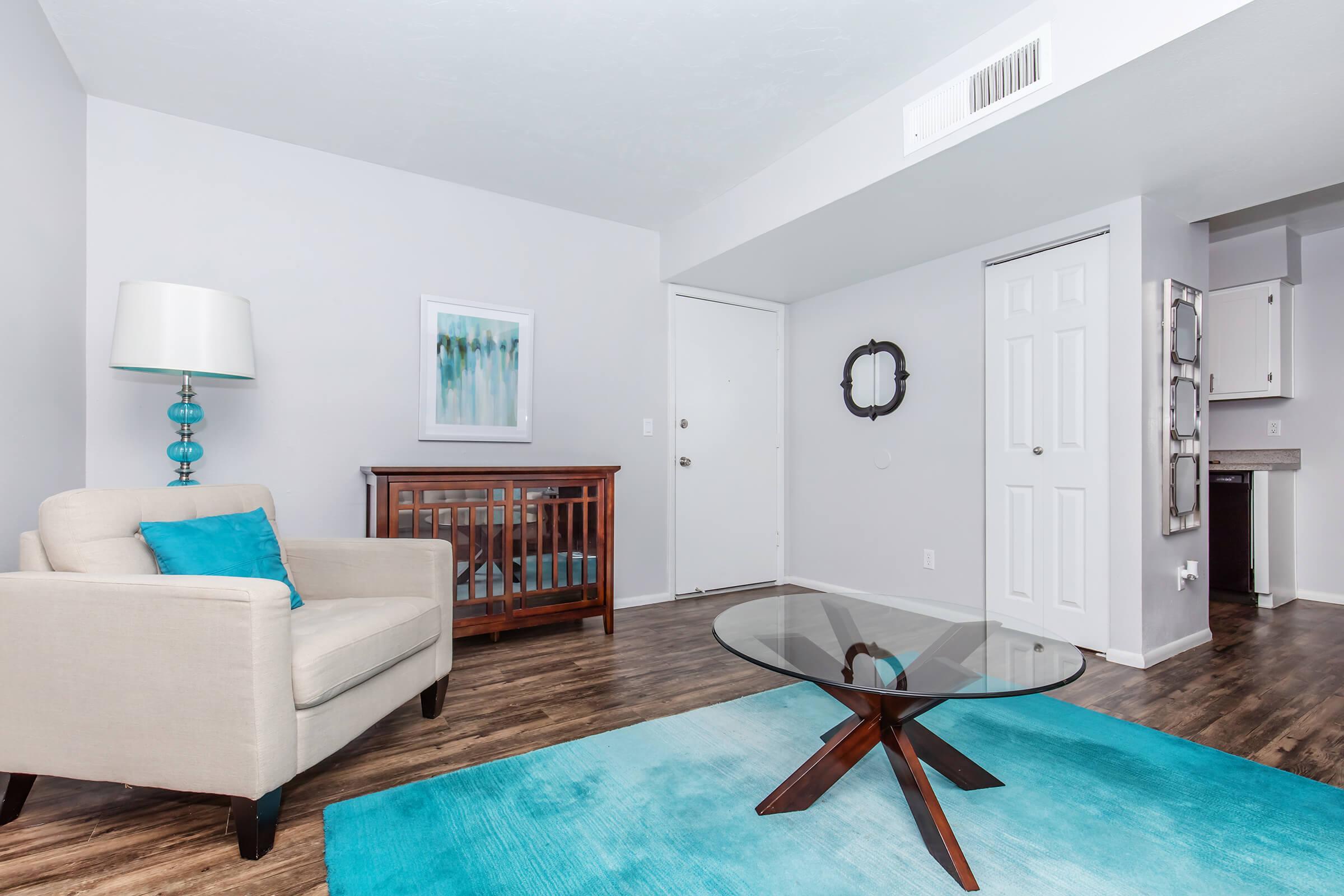 a living room filled with furniture and a rug