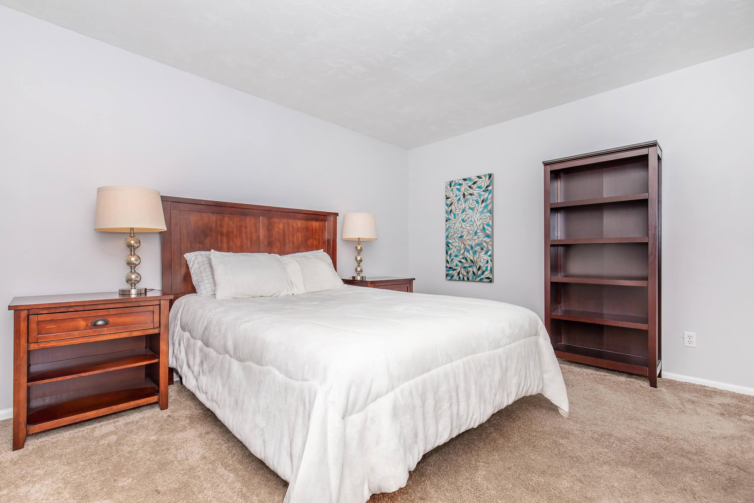 a bedroom with a bed in a hotel room