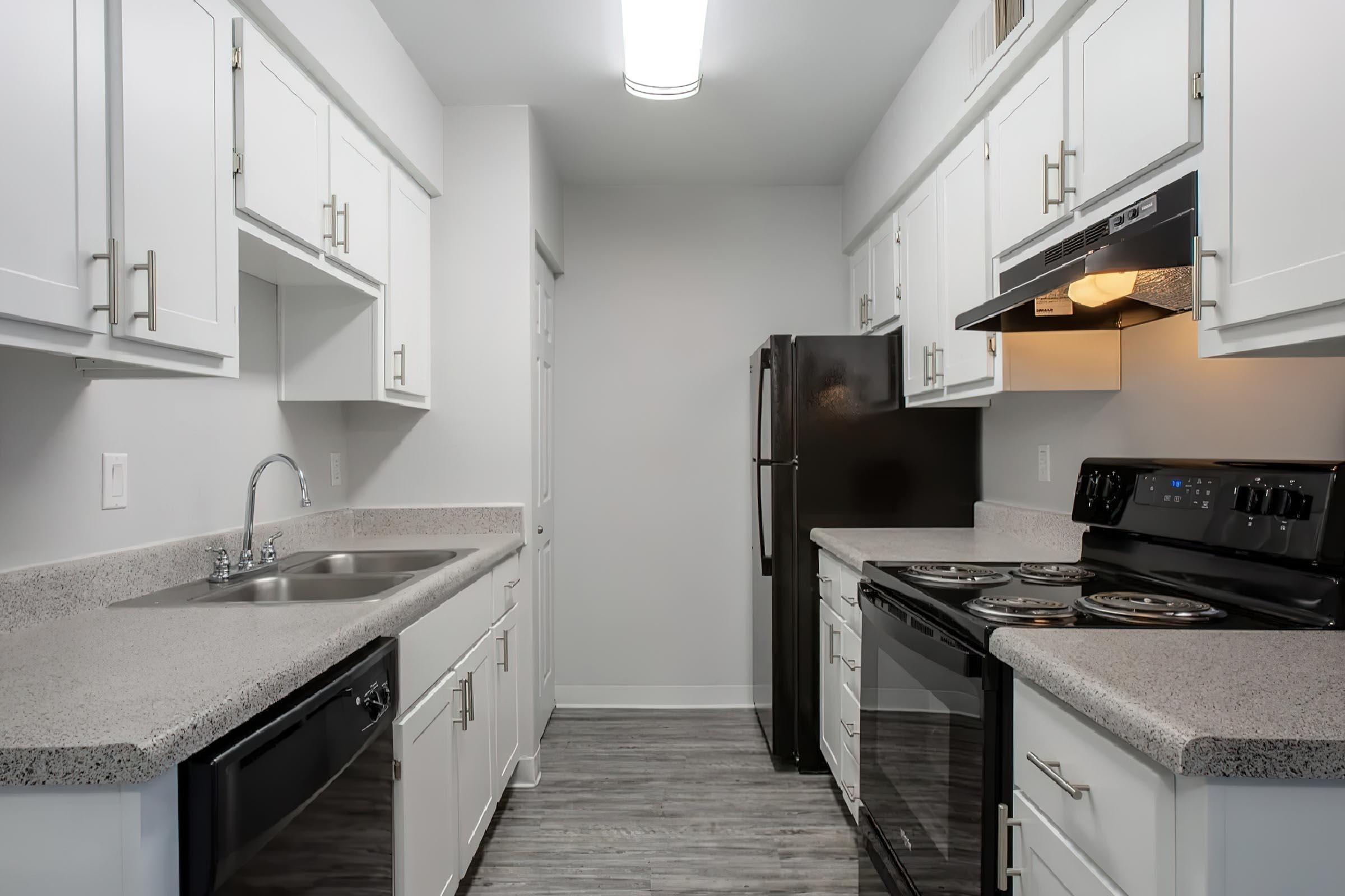 a kitchen with a stove top oven