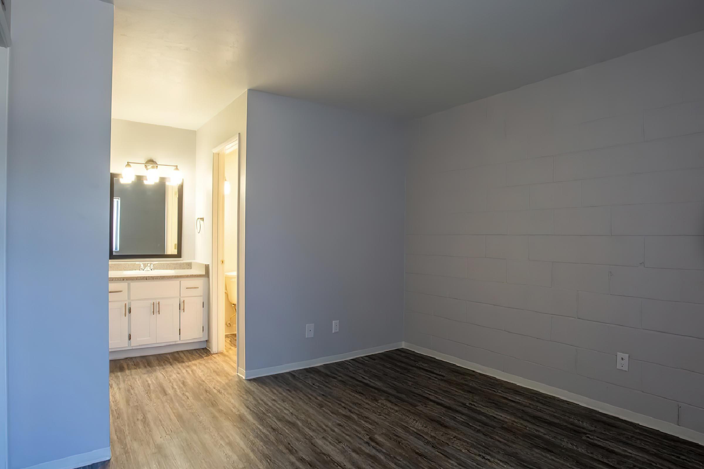 a kitchen with a wood floor