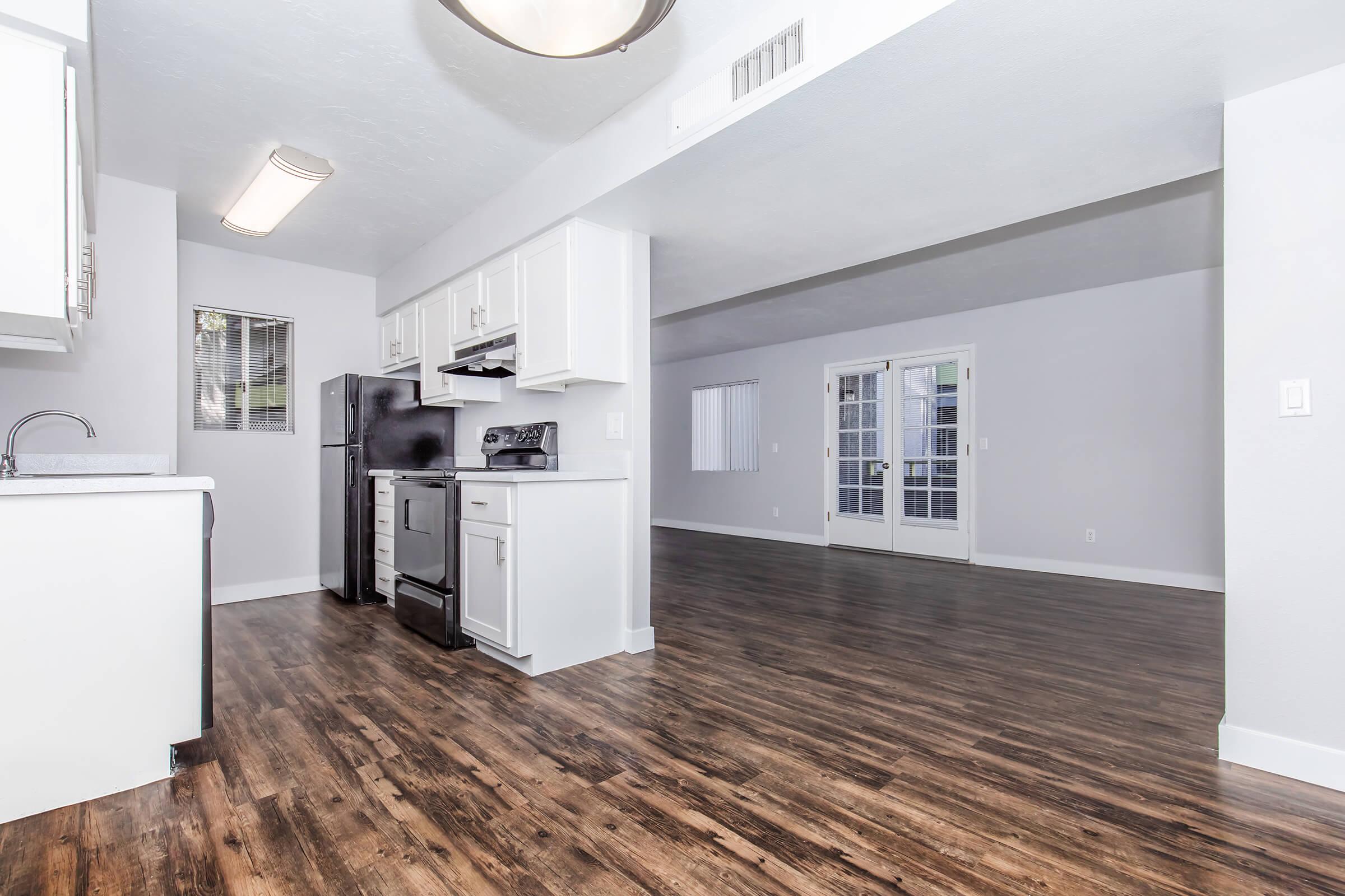 a kitchen with a stove and a refrigerator