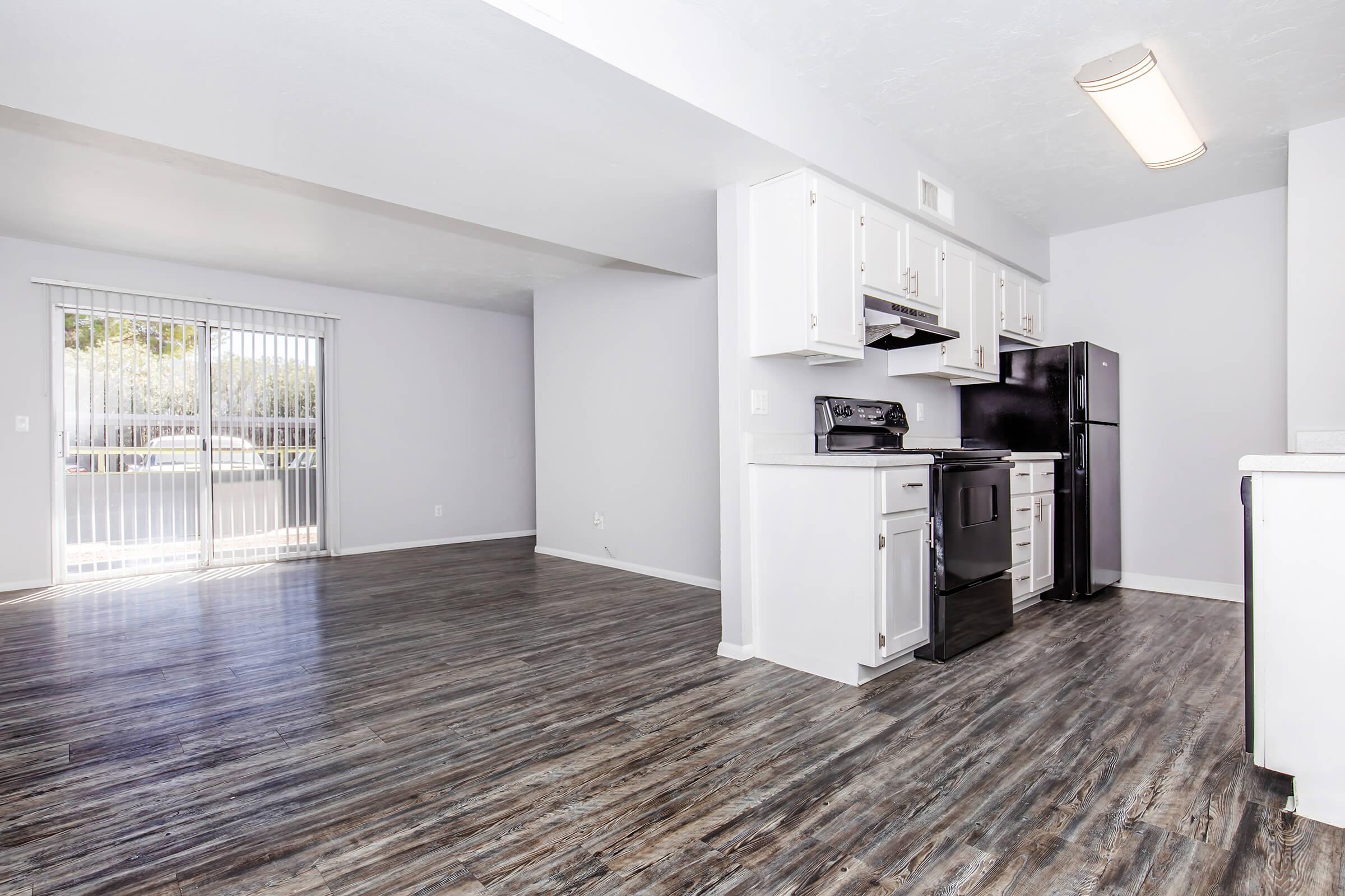 a kitchen area with a building in the background