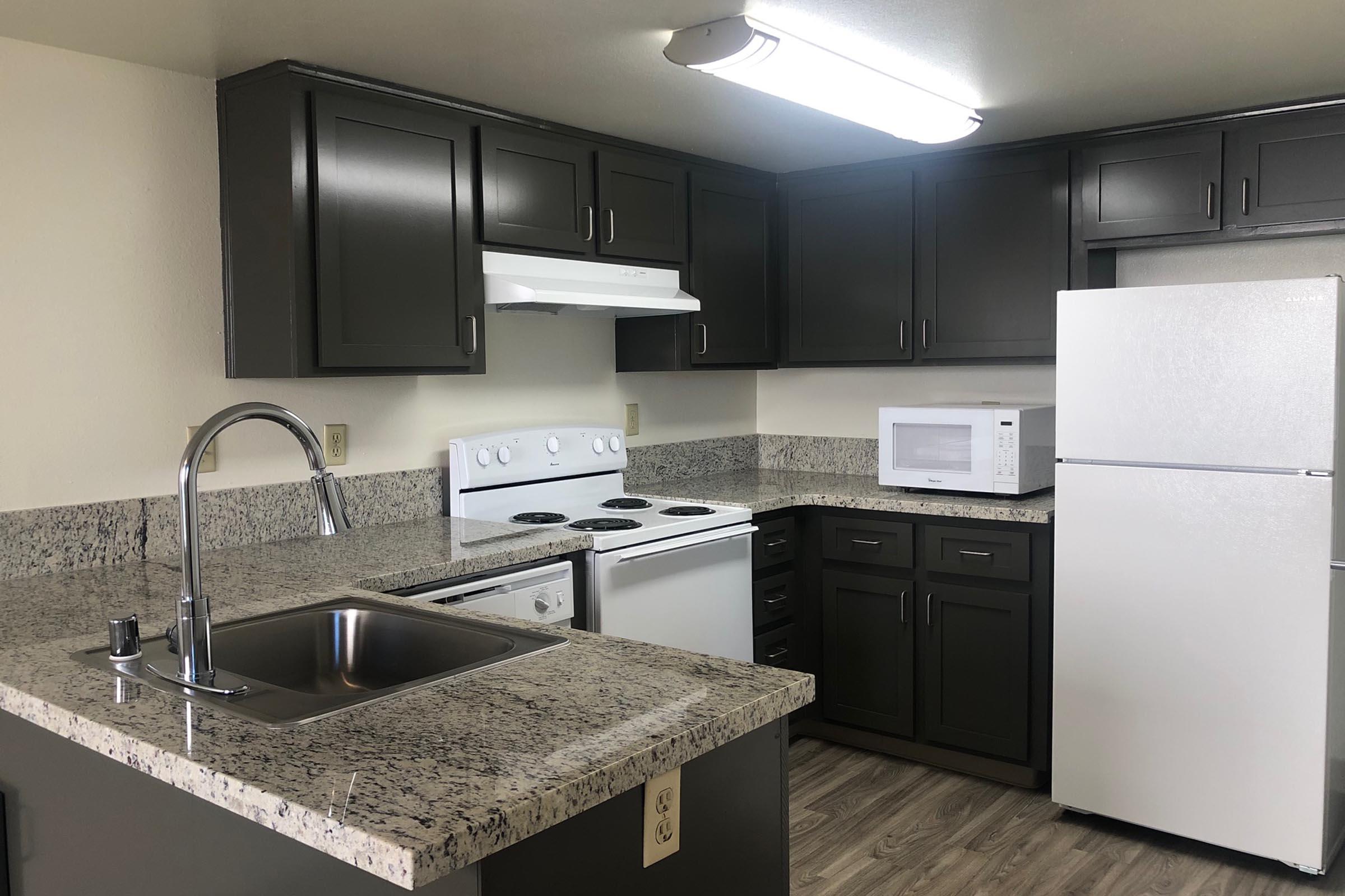 a modern kitchen with stainless steel appliances