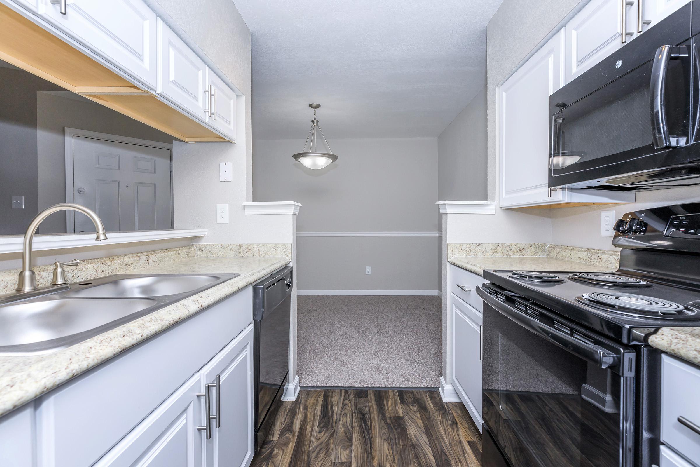 a kitchen with a stove and a sink