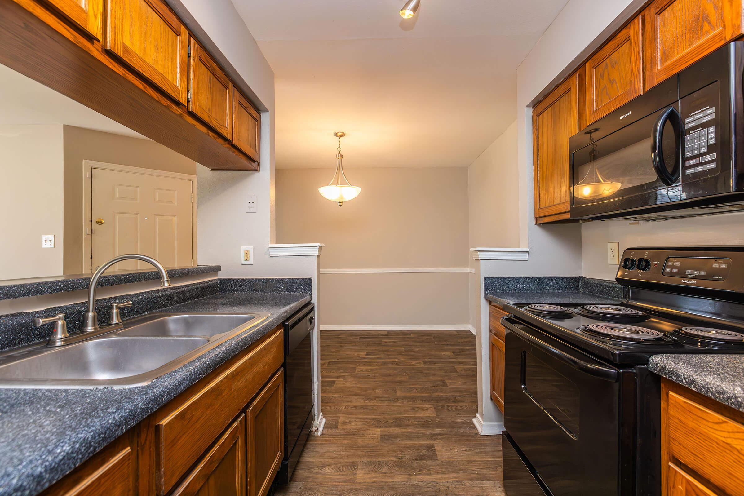 a kitchen with a stove top oven