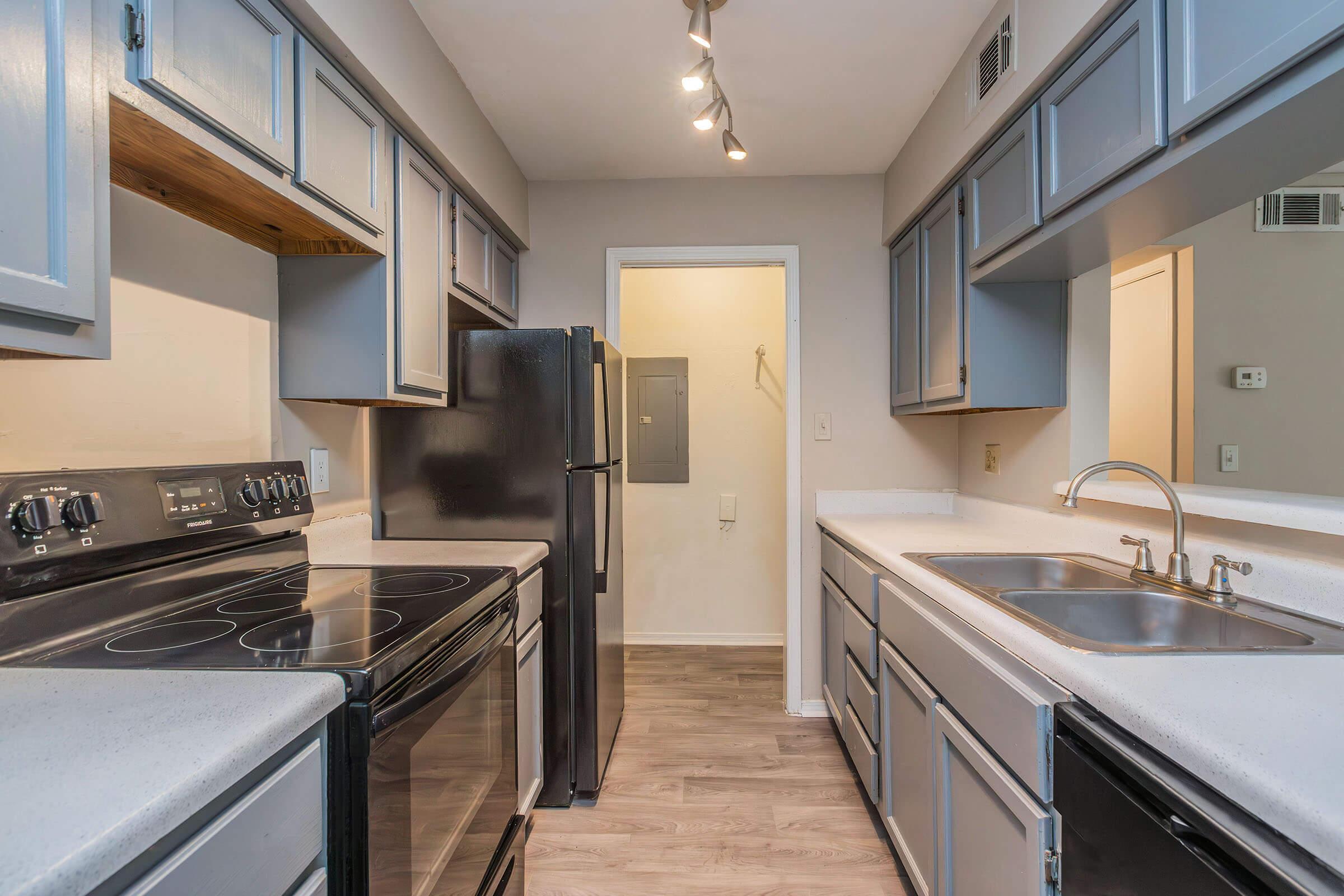 a large kitchen with stainless steel appliances