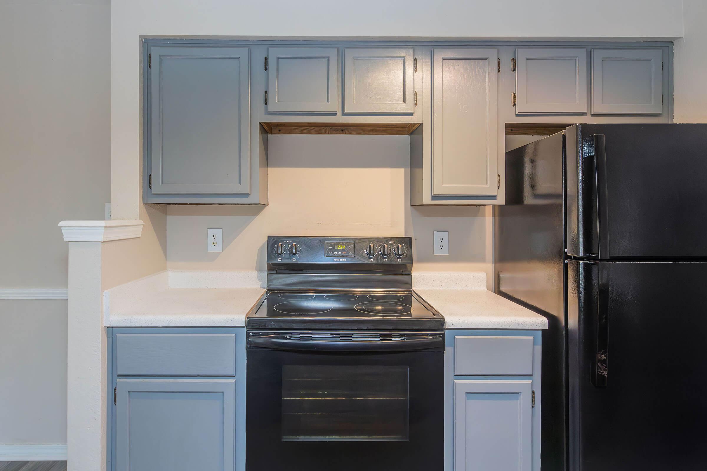 a kitchen with a stove top oven sitting inside of a refrigerator