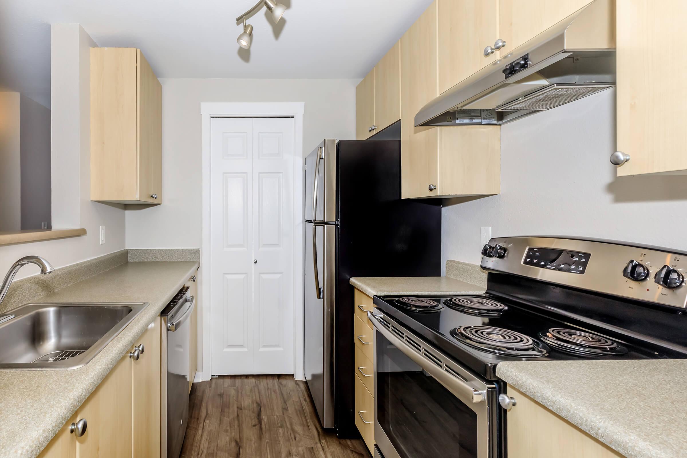 a kitchen with a stove top oven