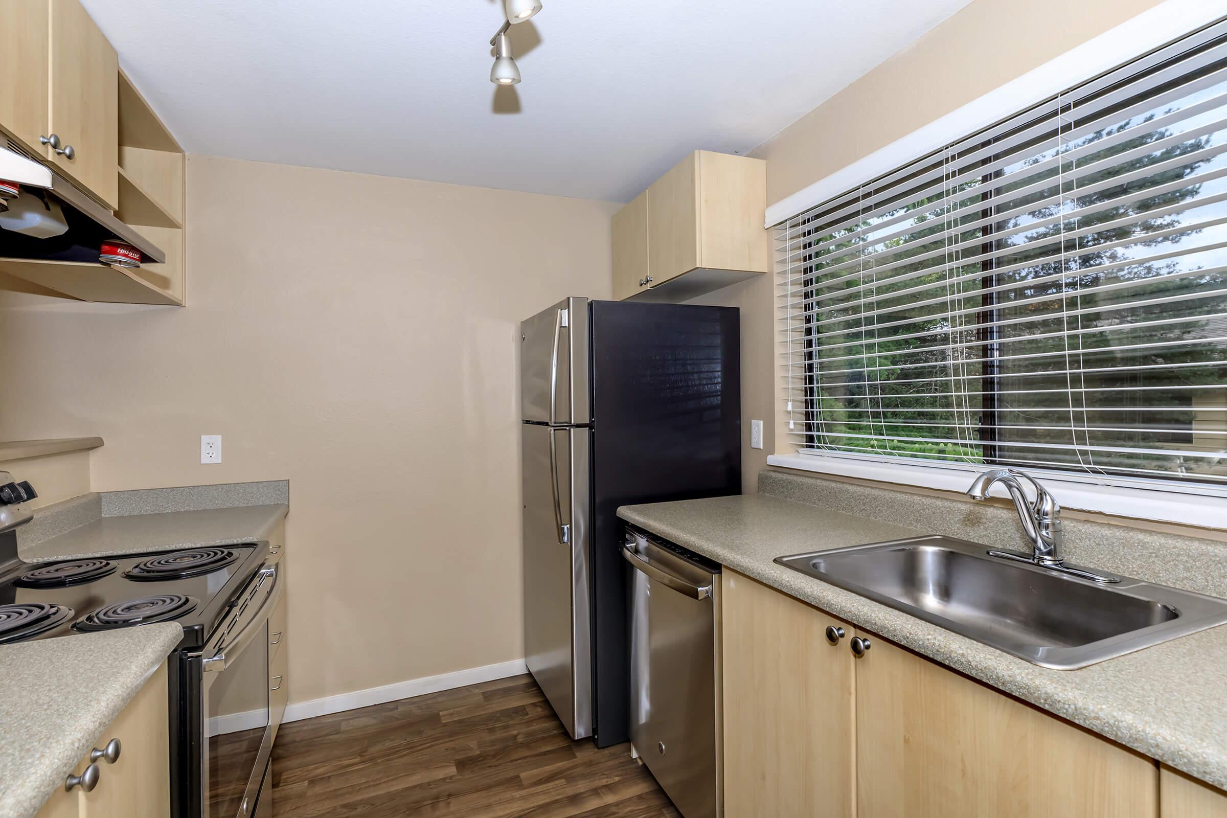 a modern kitchen with stainless steel appliances