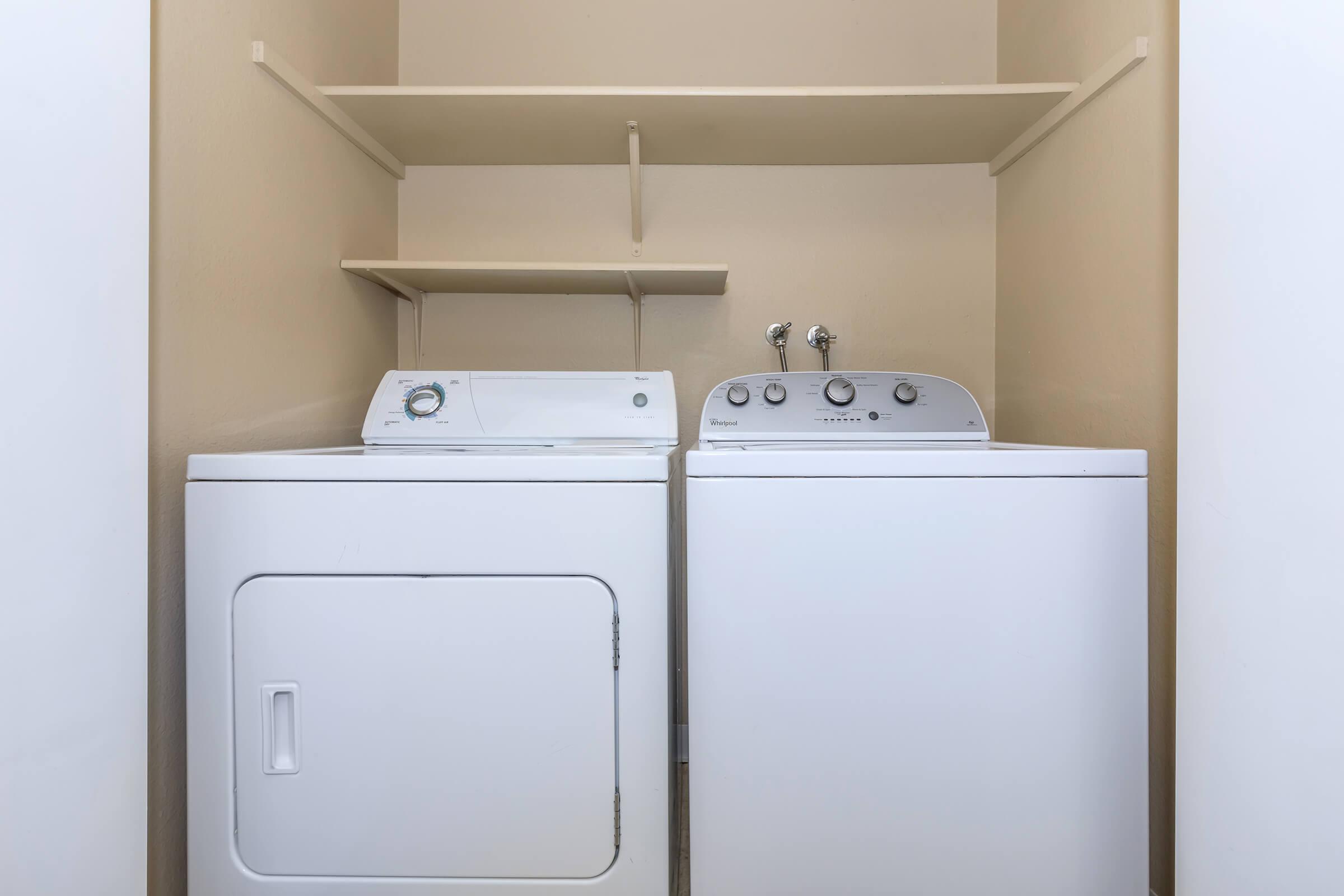 a refrigerator freezer sitting next to a sink